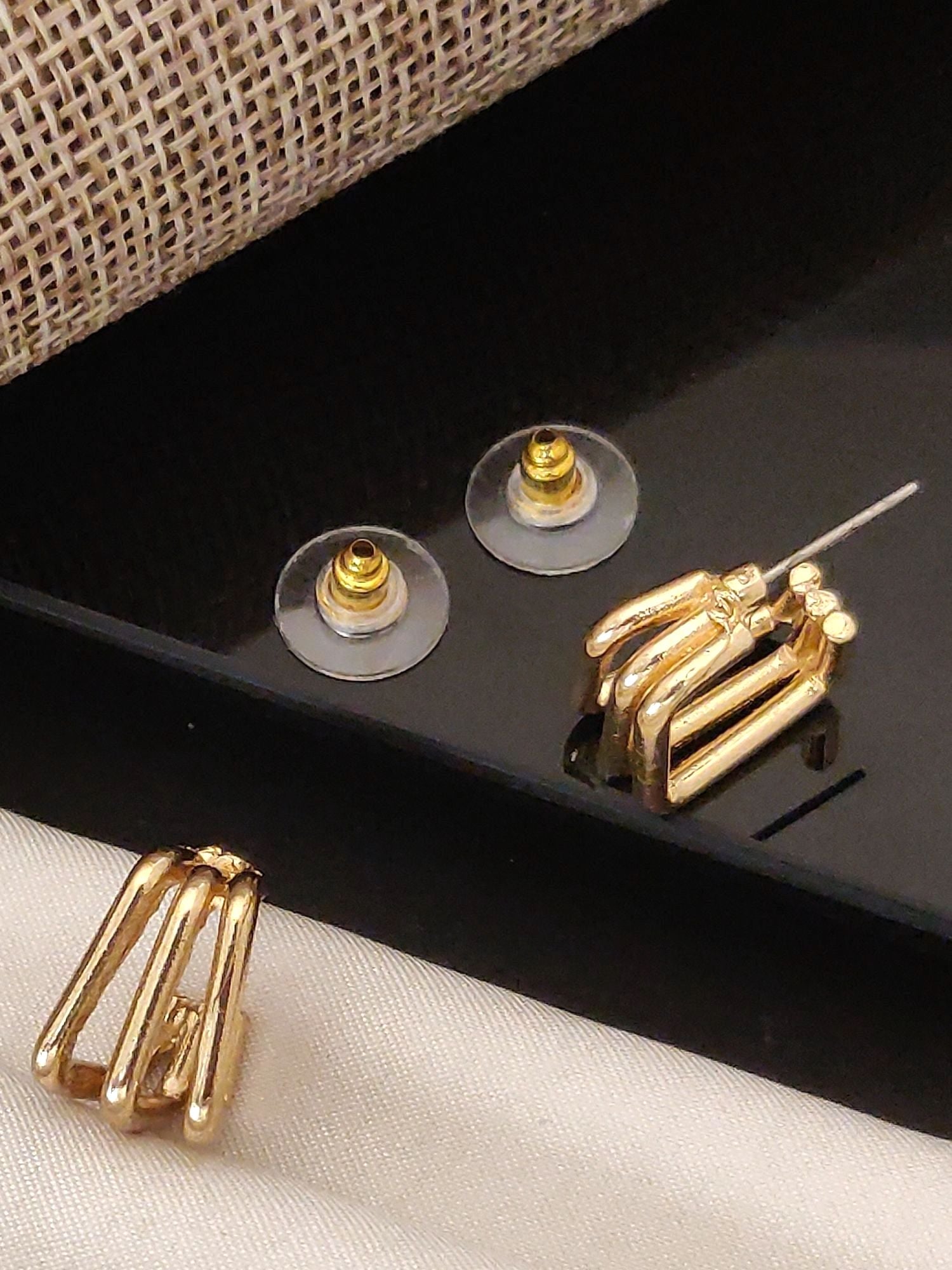 Abdesignsjewellery Fancy Gold Plated Western Studs Earring pair showing gold multi bar stud design with clear backs