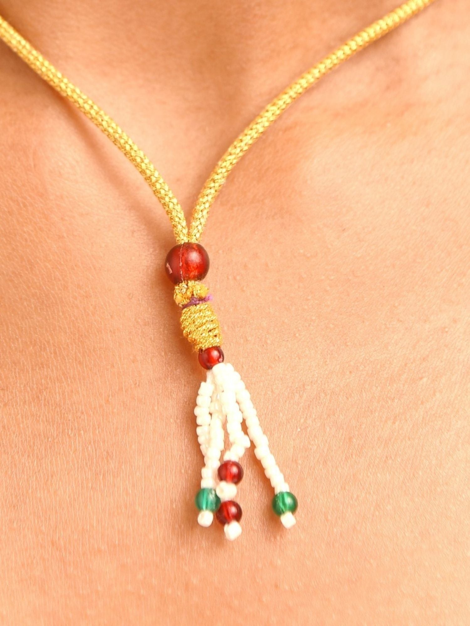 Abdesignsjewellery gold braided cord necklace with tassel pendant and red green beads fashion polki necklace with earrings