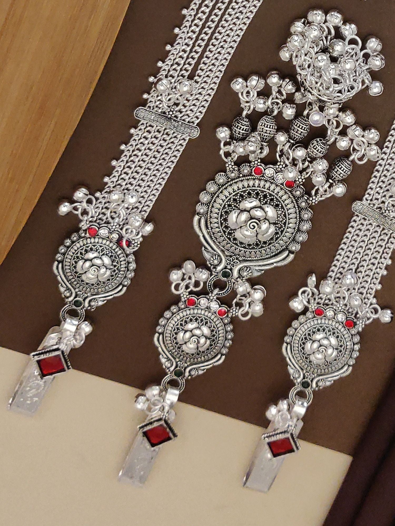 Elegant German silver juda pin combo with intricate floral designs and red accents