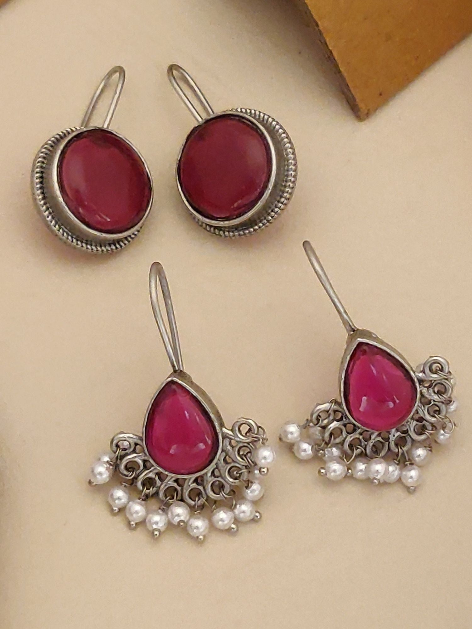 German Silver Set Of 2 Earring Combo featuring round and jhumka styles with pink stones and pearl accents