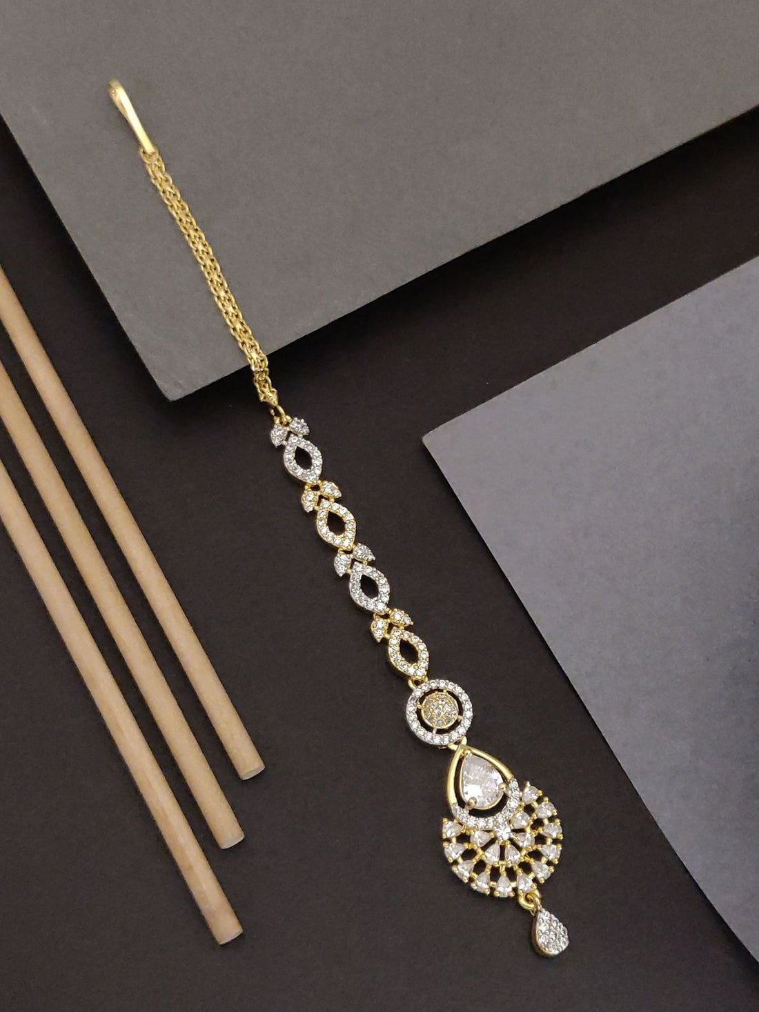 Elegant Gold Plated American Diamond Maangtikka with intricate design and sparkling stones