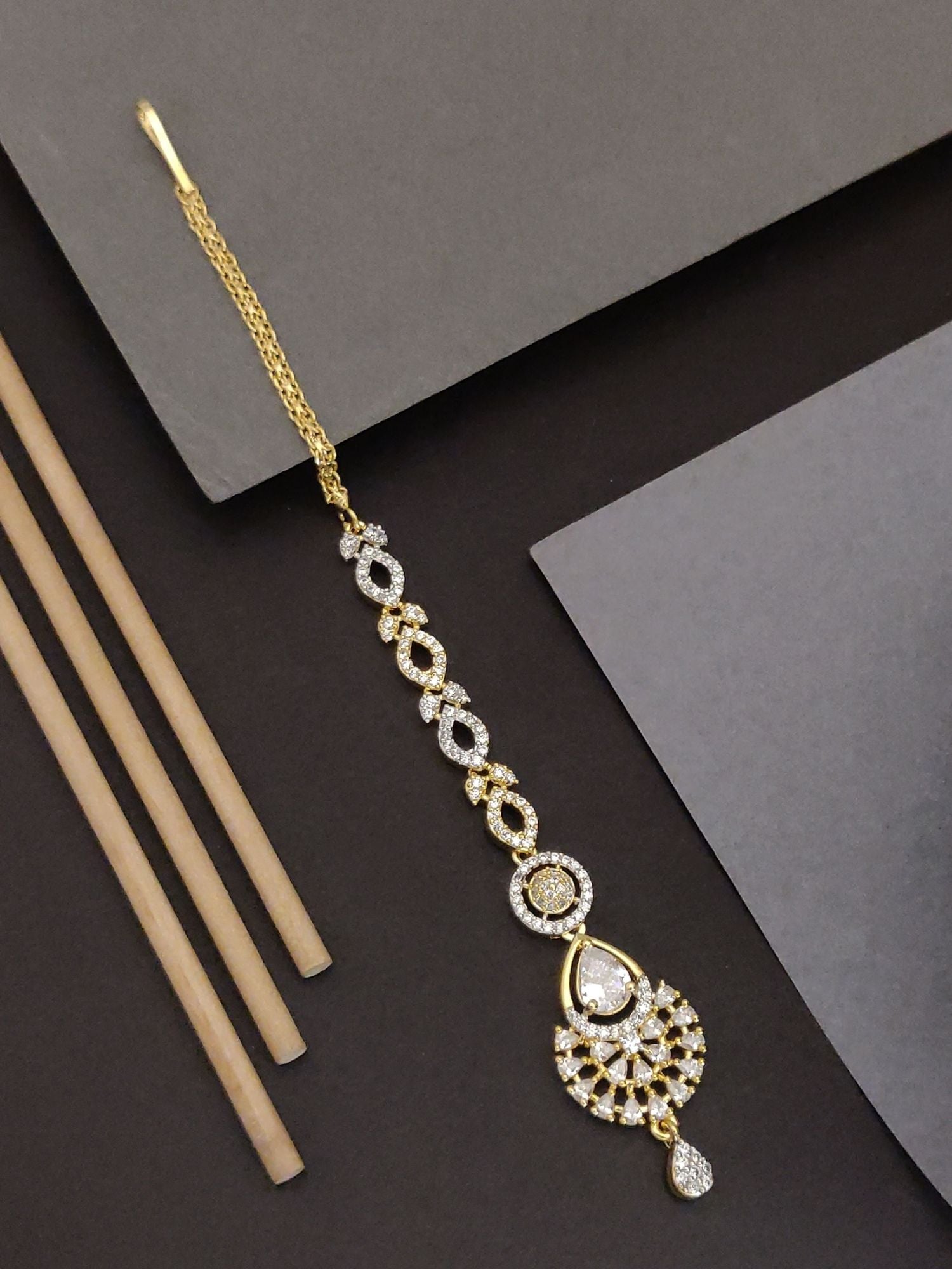 Elegant Gold Plated American Diamond Maangtikka with intricate design and sparkling stones