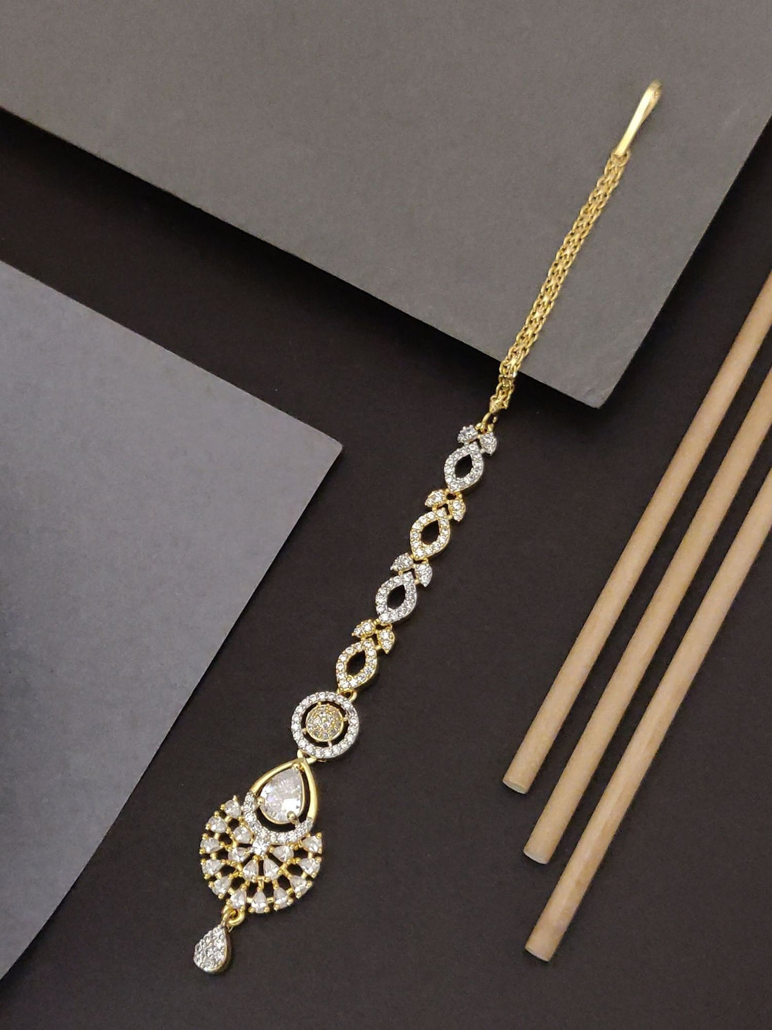 Elegant Gold Plated American Diamond Maangtikka with intricate design and sparkling stones