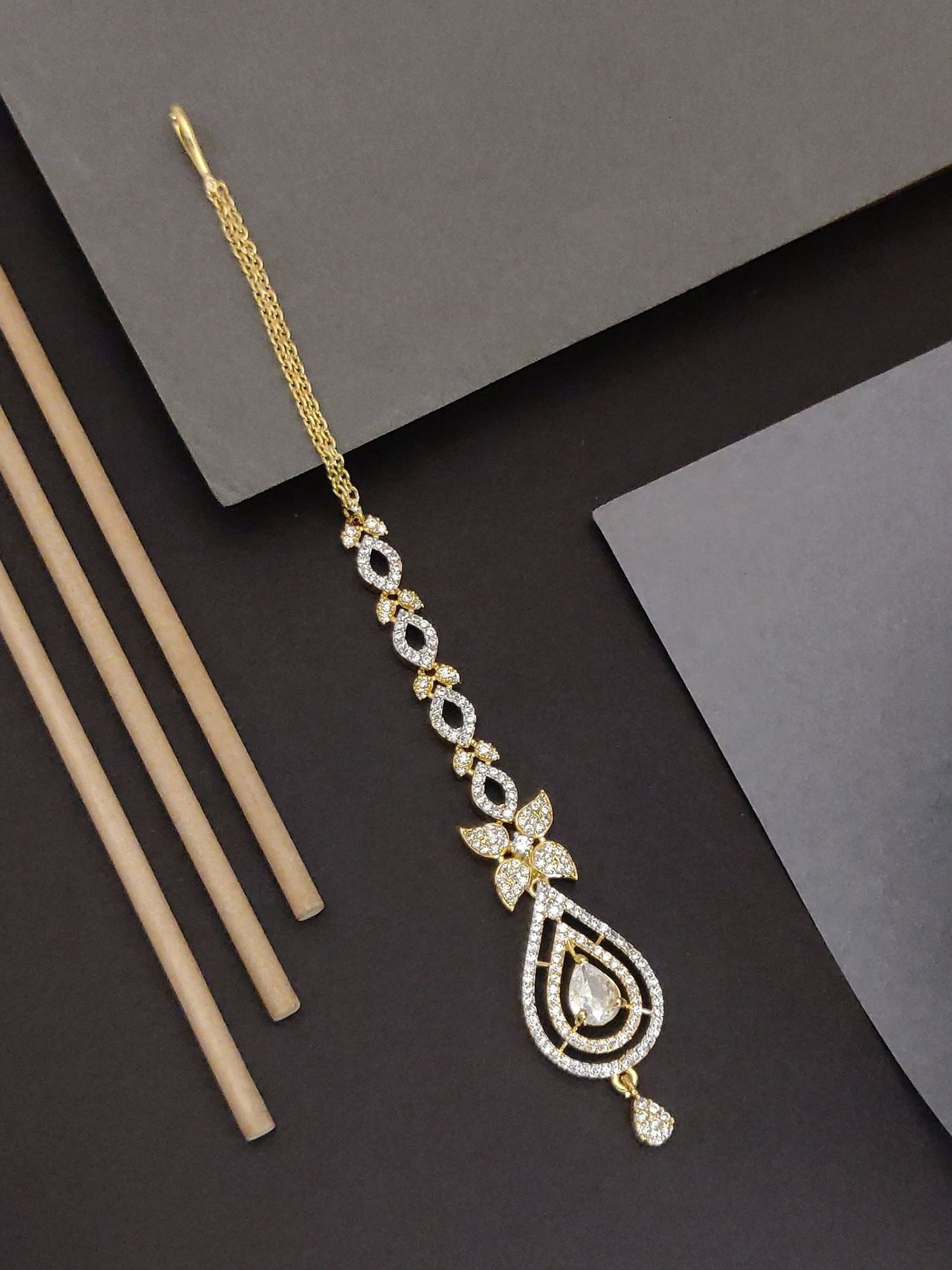 Gold Plated American Diamond Maangtikka with elegant design and intricate detailing for traditional outfits