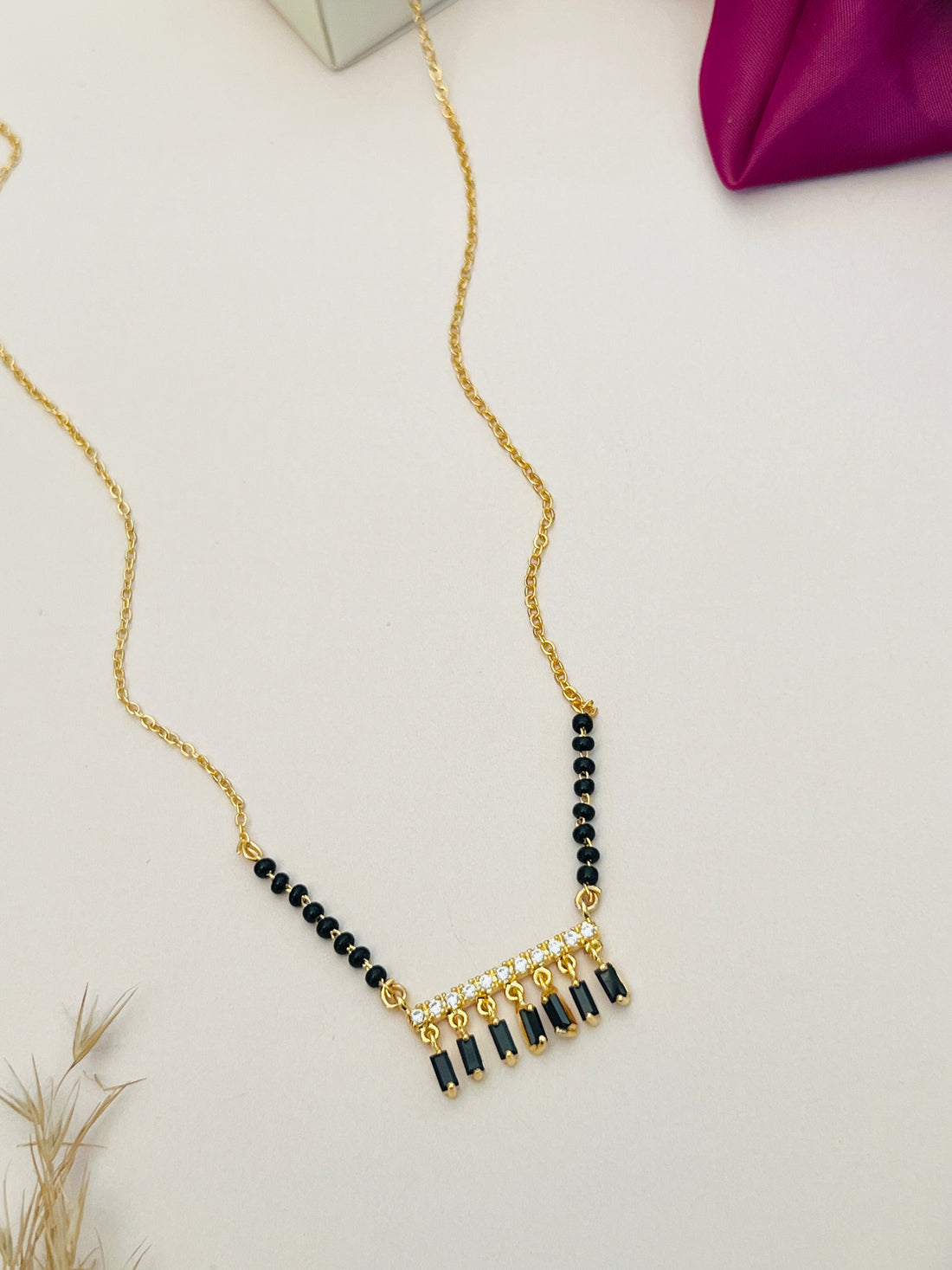 Gold Plated American Diamond Mangalsutra with black beads and delicate hanging design