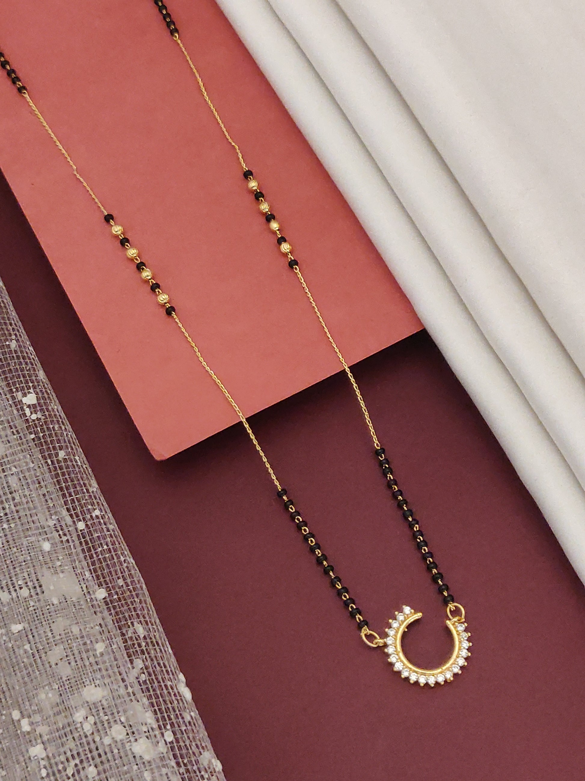 Elegant Gold Plated American Diamond Mangalsutra with intricate designs, perfect for traditional occasions