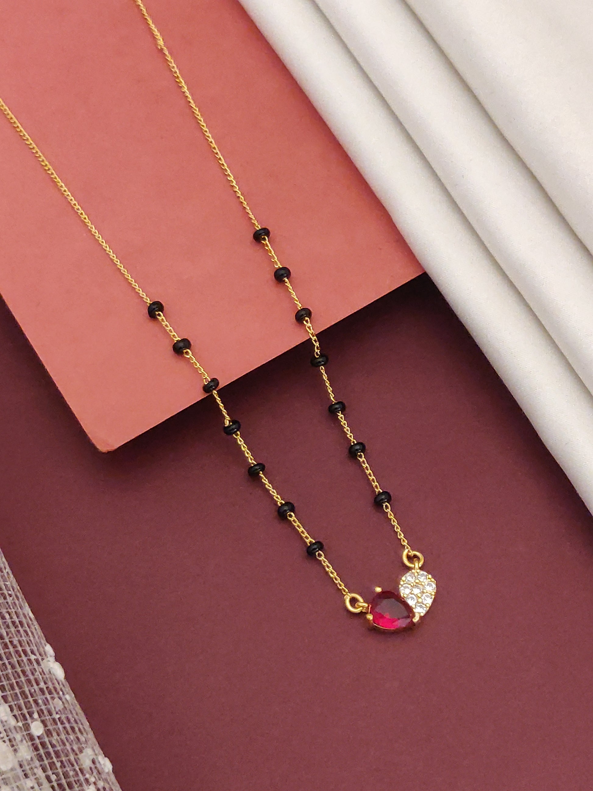Gold Plated American Diamond Mangalsutra with Red Heart Pendant and Elegant Design for Everyday Wear
