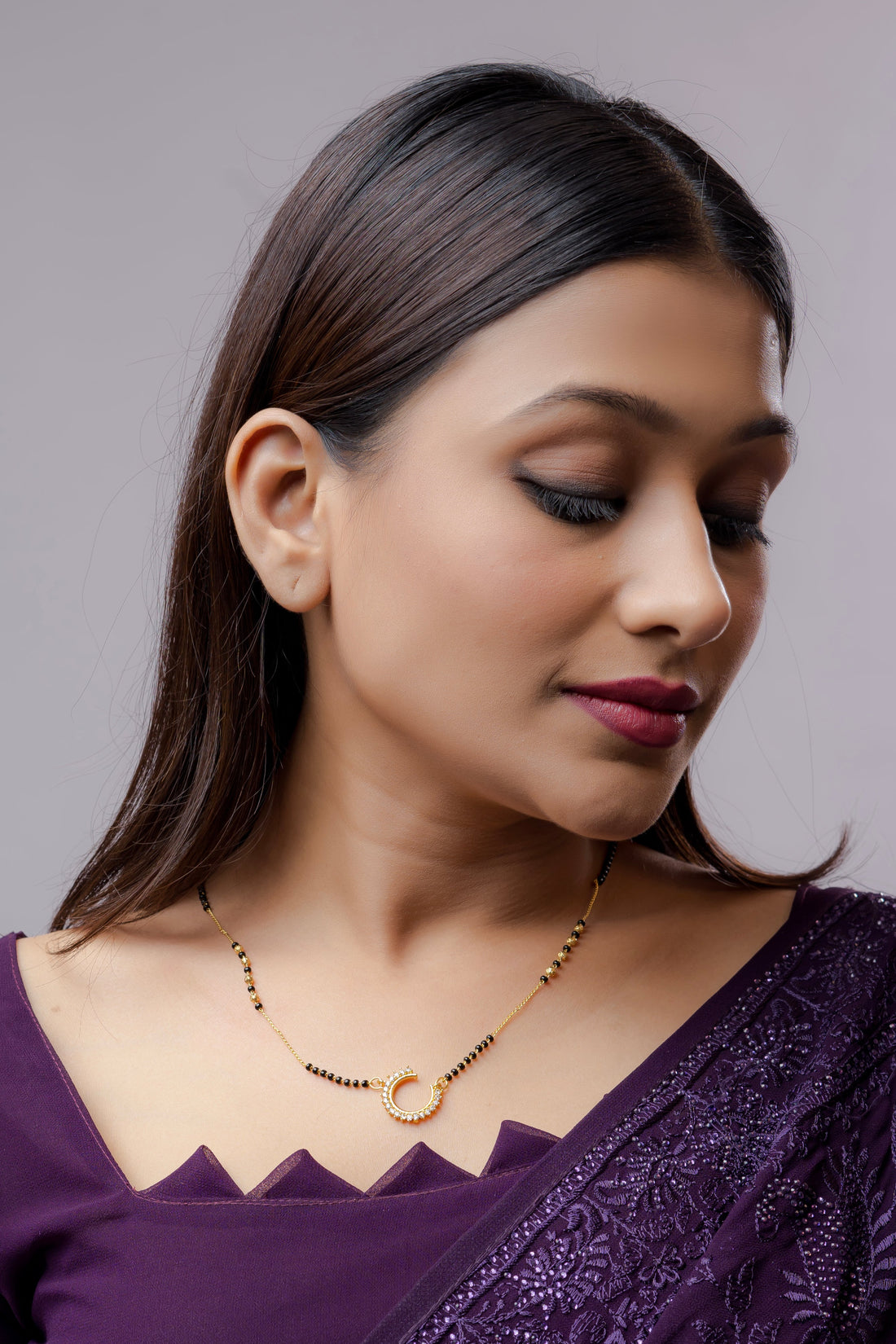 Elegant Gold Plated American Diamond Mangalsutra with intricate design worn by a woman