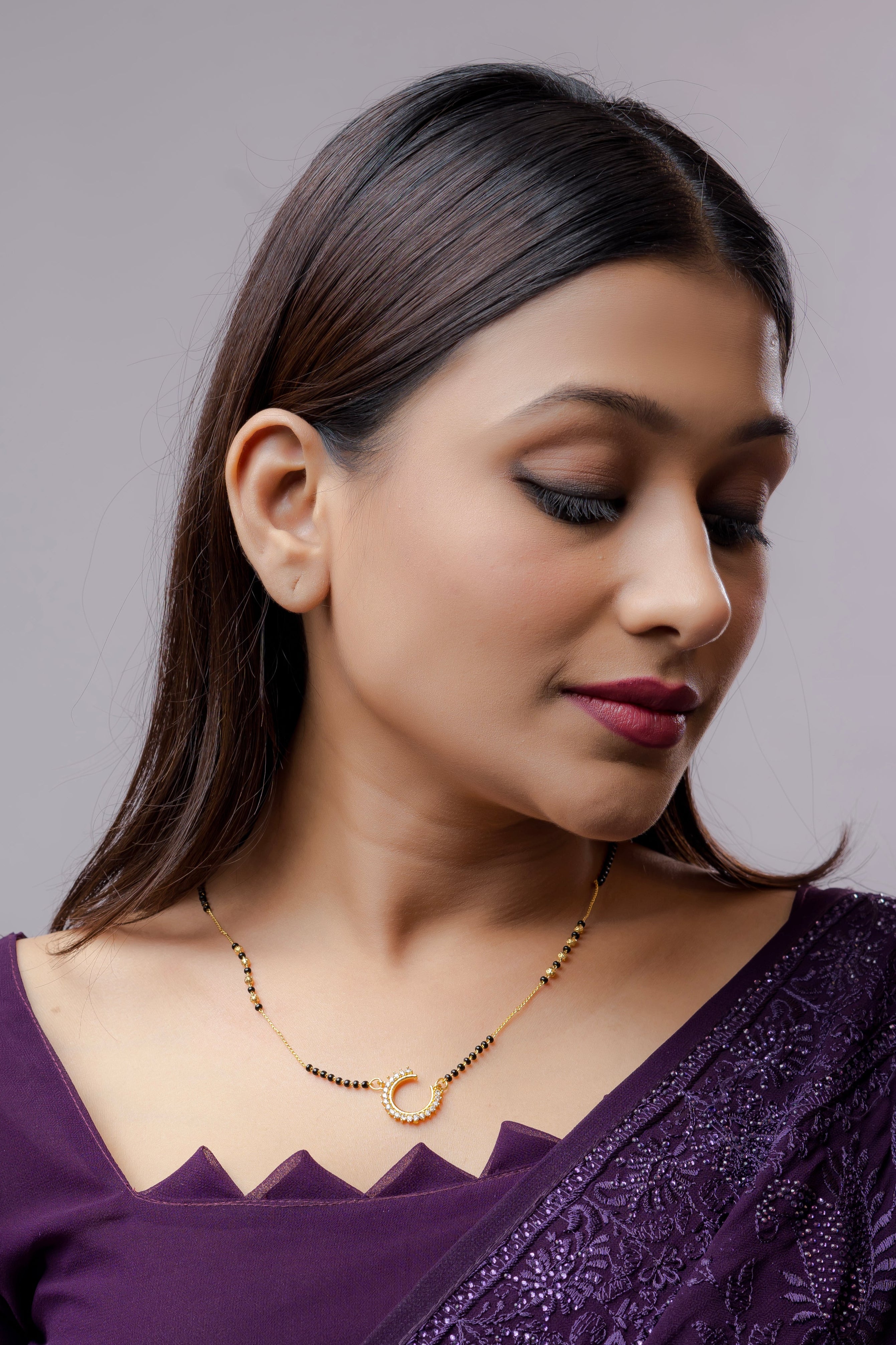 Elegant Gold Plated American Diamond Mangalsutra with intricate design worn by a woman