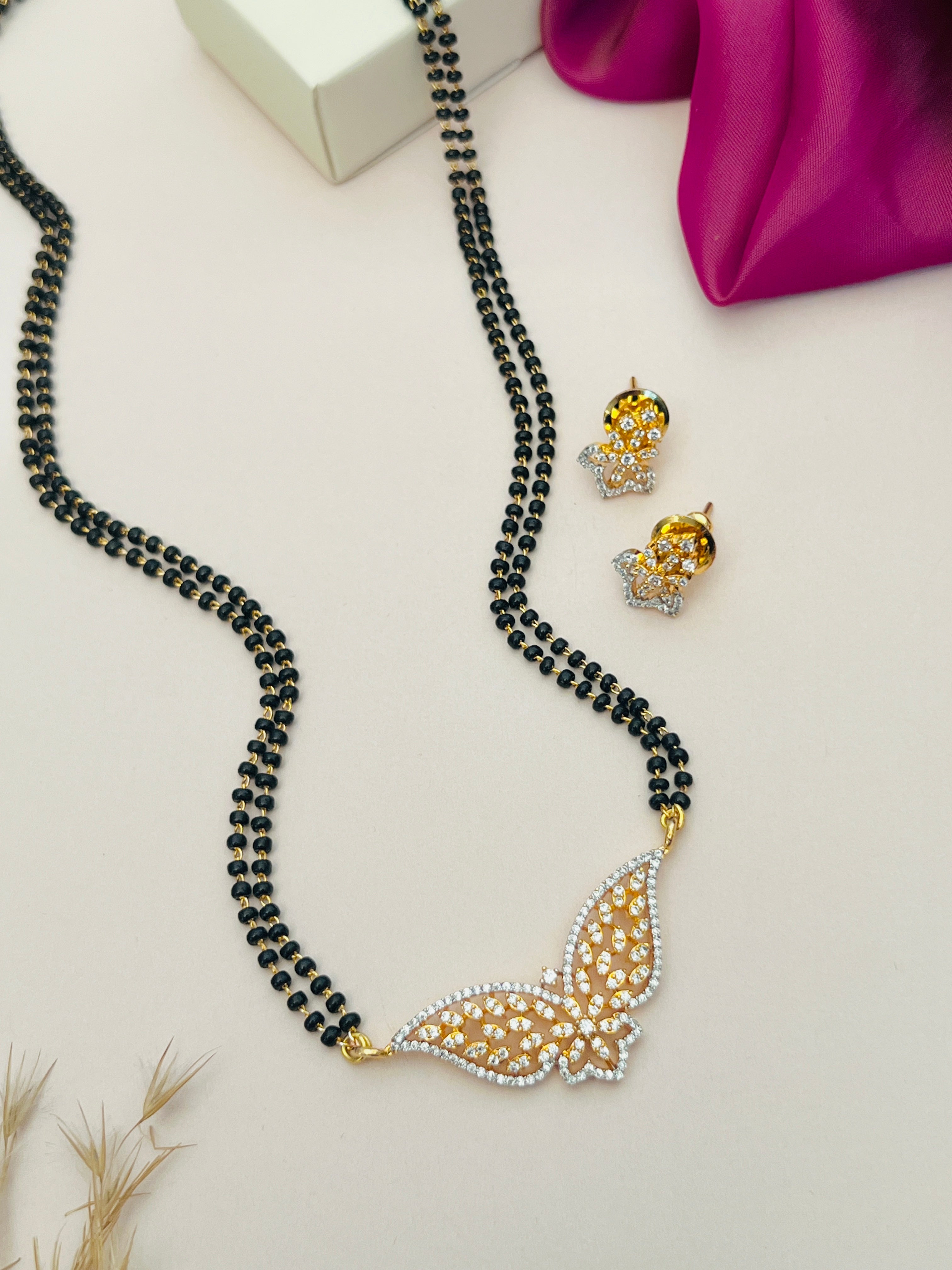 Gold Plated American Diamond Mangalsutra Set with black beads and butterfly pendant from Abdesignsjewellery