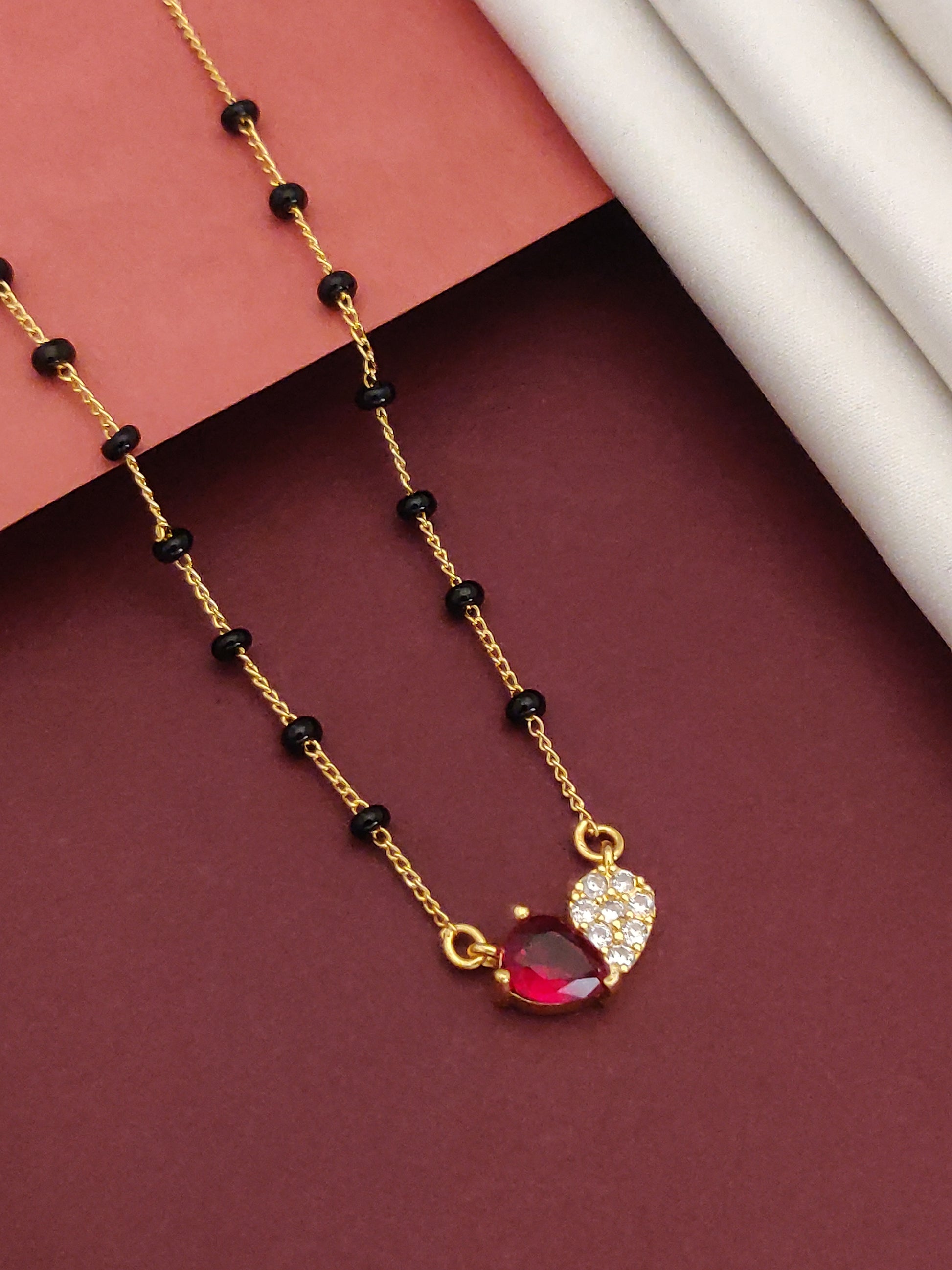 Gold Plated American Diamond Mangalsutra with Elegant Red and White Gemstone Pendant
