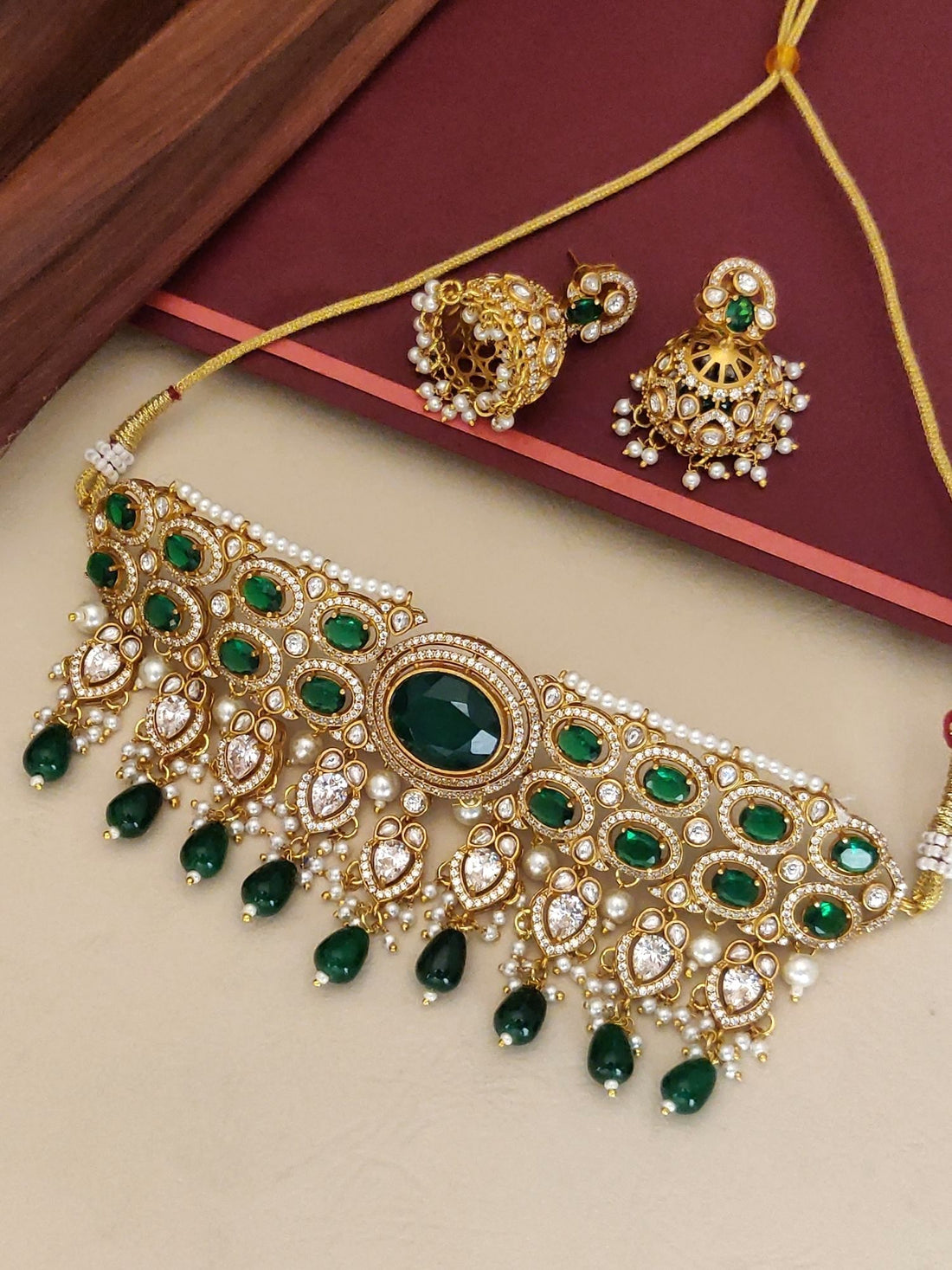 Gold Plated American Diamond Necklace Set with green stones and matching earrings for elegant occasions