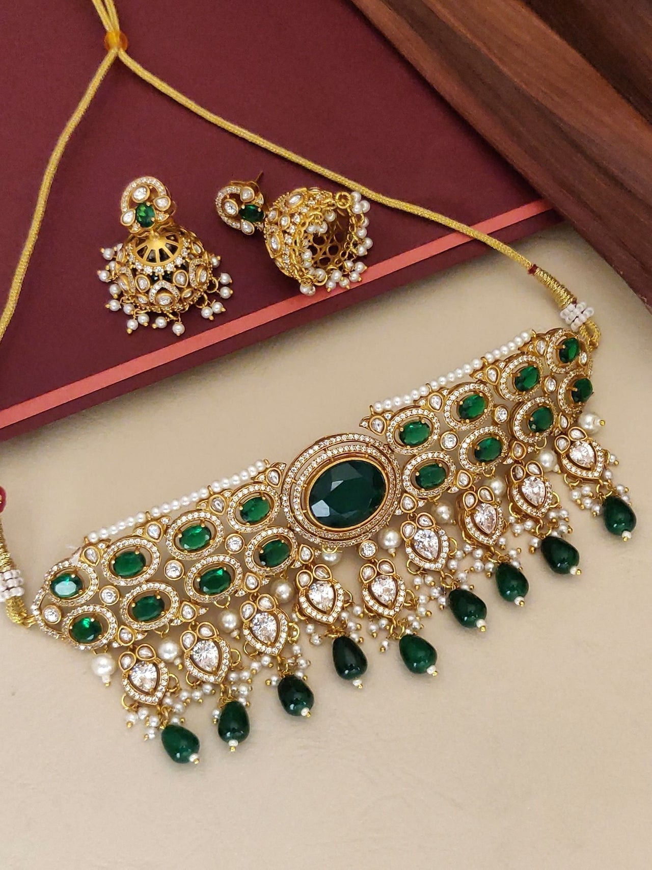 Gold Plated American Diamond Necklace Set with green stones and matching earrings for elegant occasions