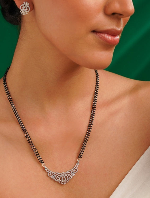 Gold Plated American Diamond Wedding Mangalsutra Set with intricate pendant worn by woman