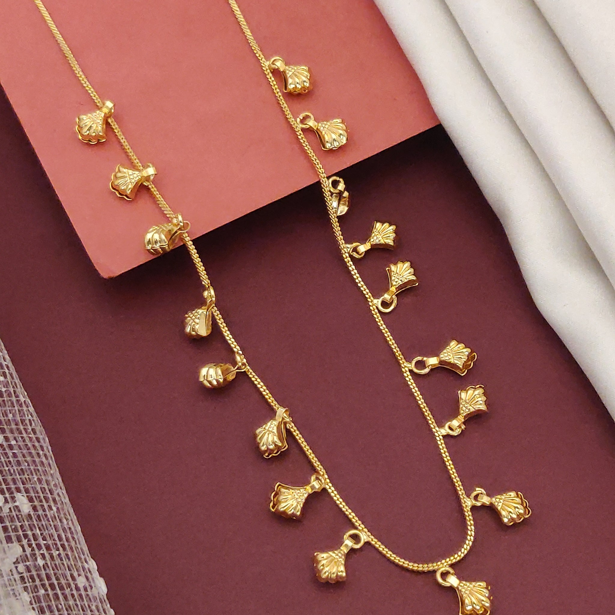 Gold plated daily wear chain with delicate leaf-shaped pendants for versatile styling