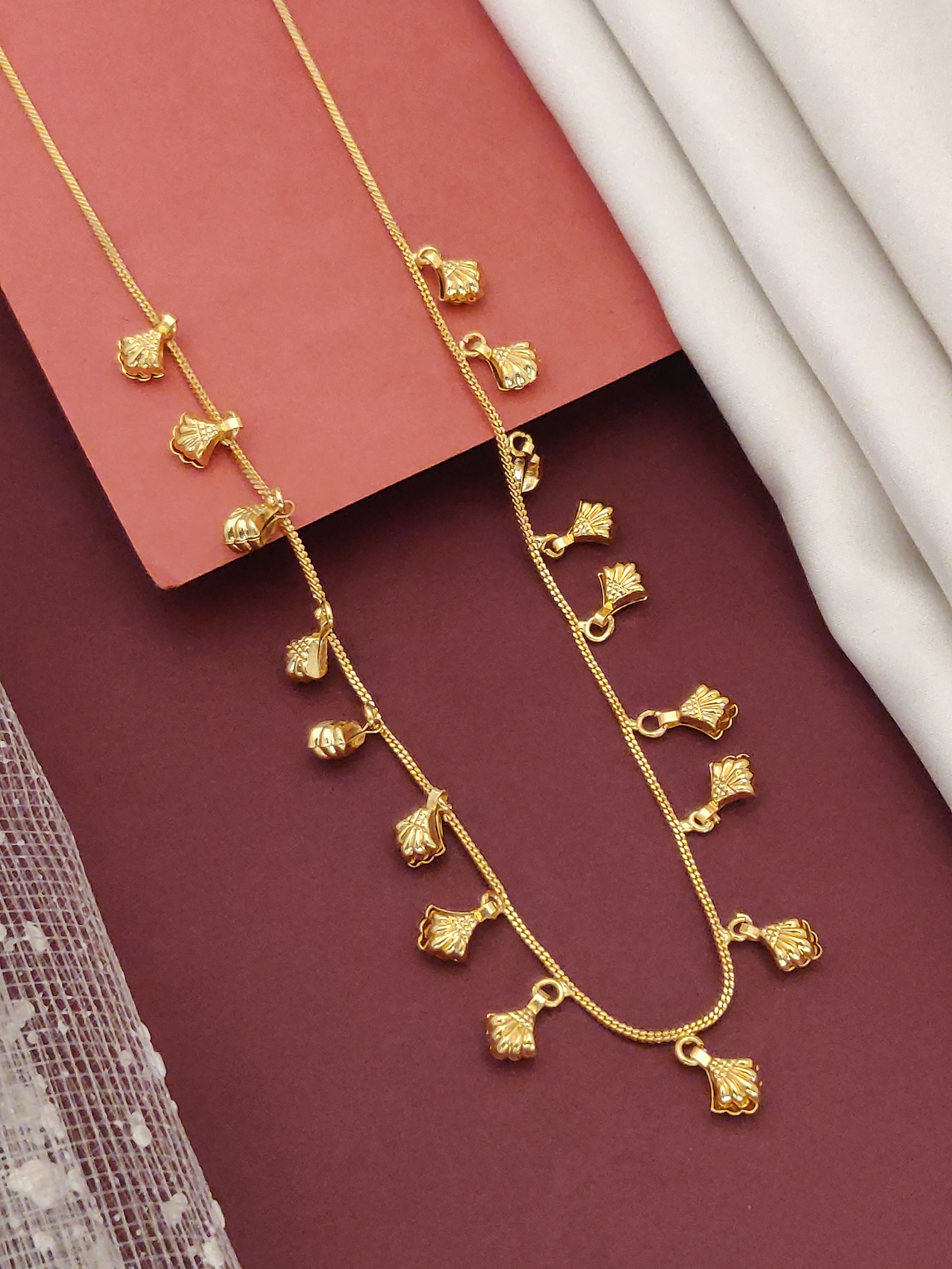 Gold plated daily wear chain with delicate leaf-shaped pendants for versatile styling