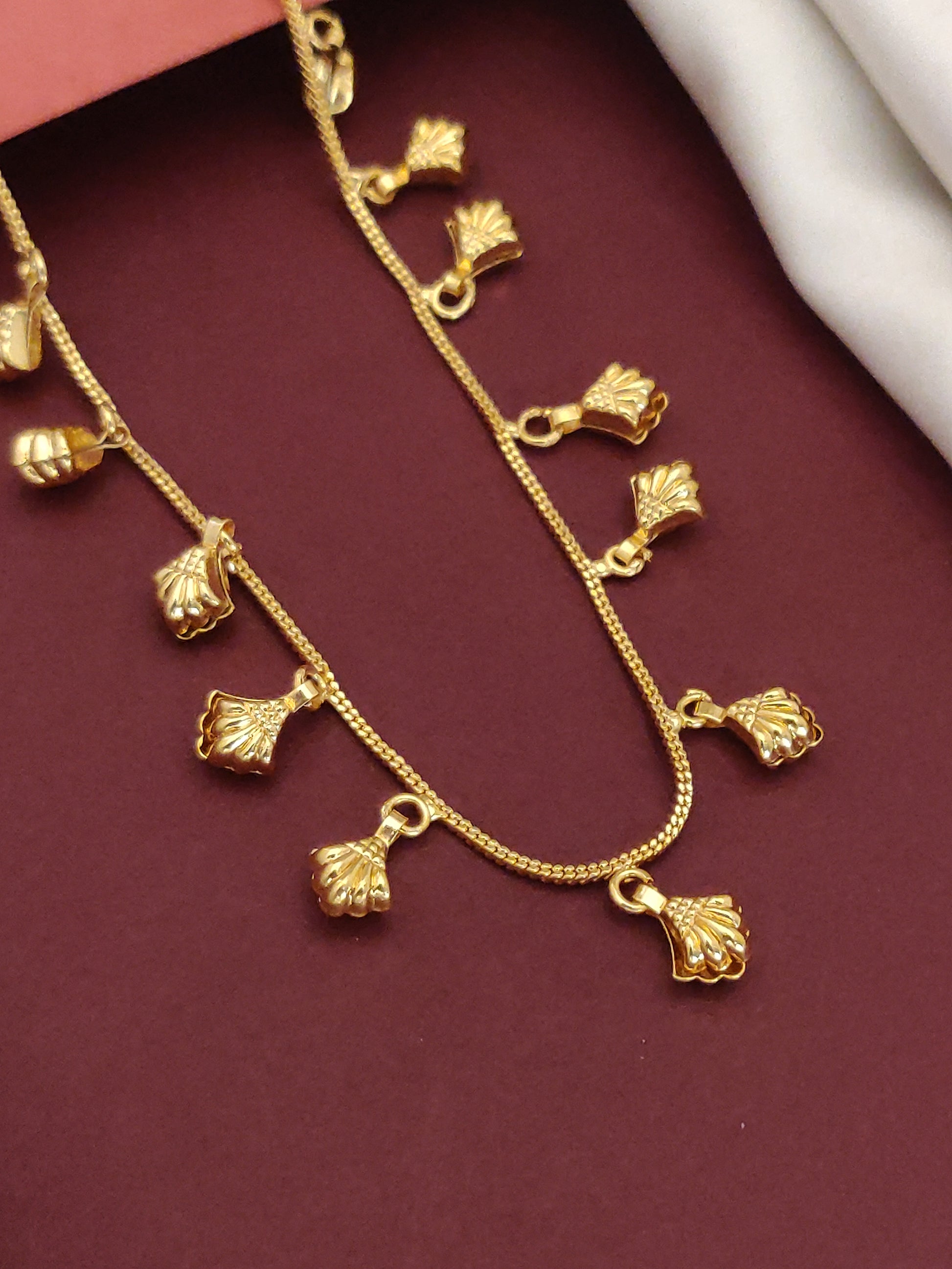 Gold plated daily wear chain with decorative pendants for everyday elegance