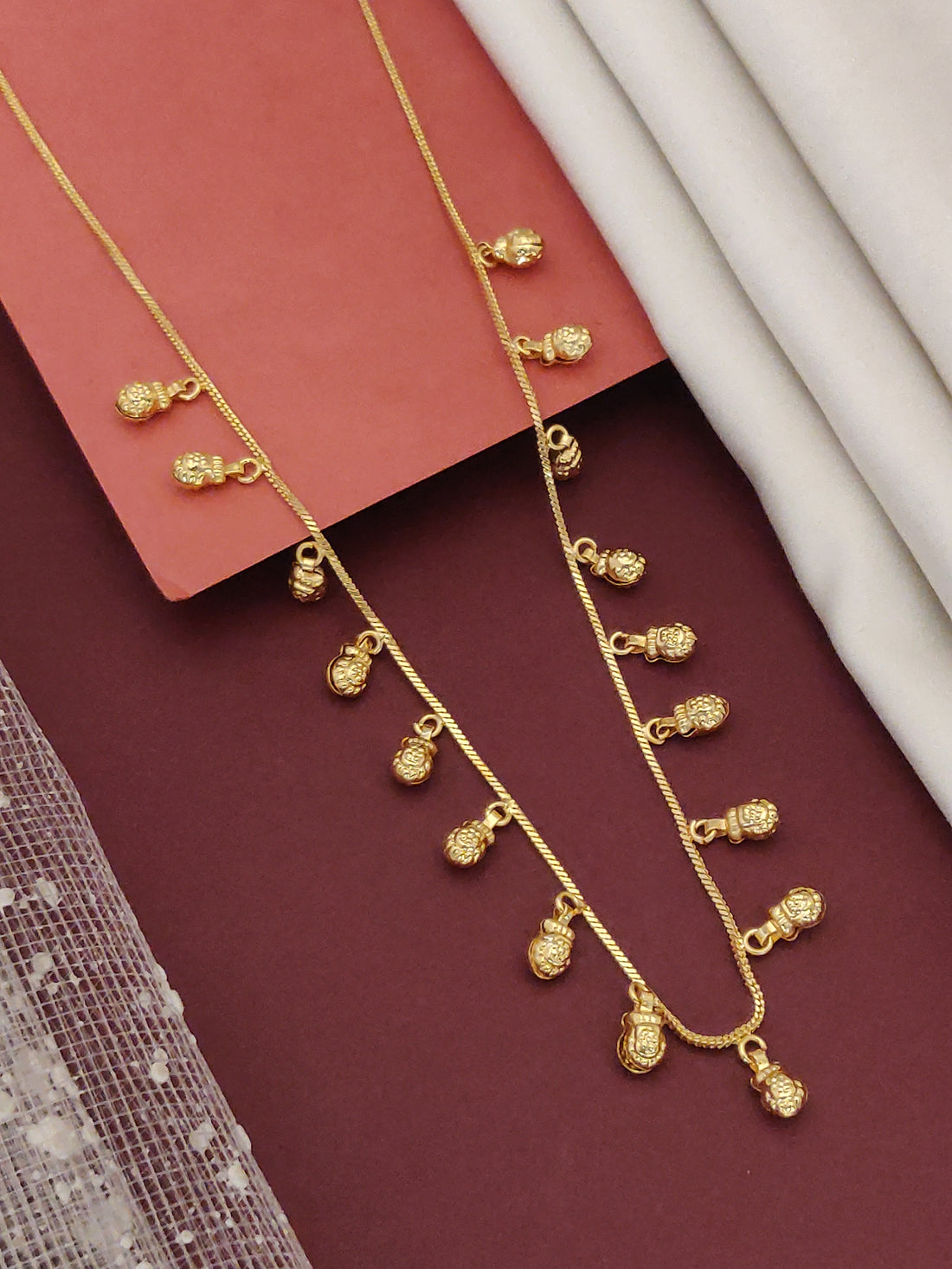 Gold plated daily wear chain with delicate leaf-shaped pendants for versatile styling