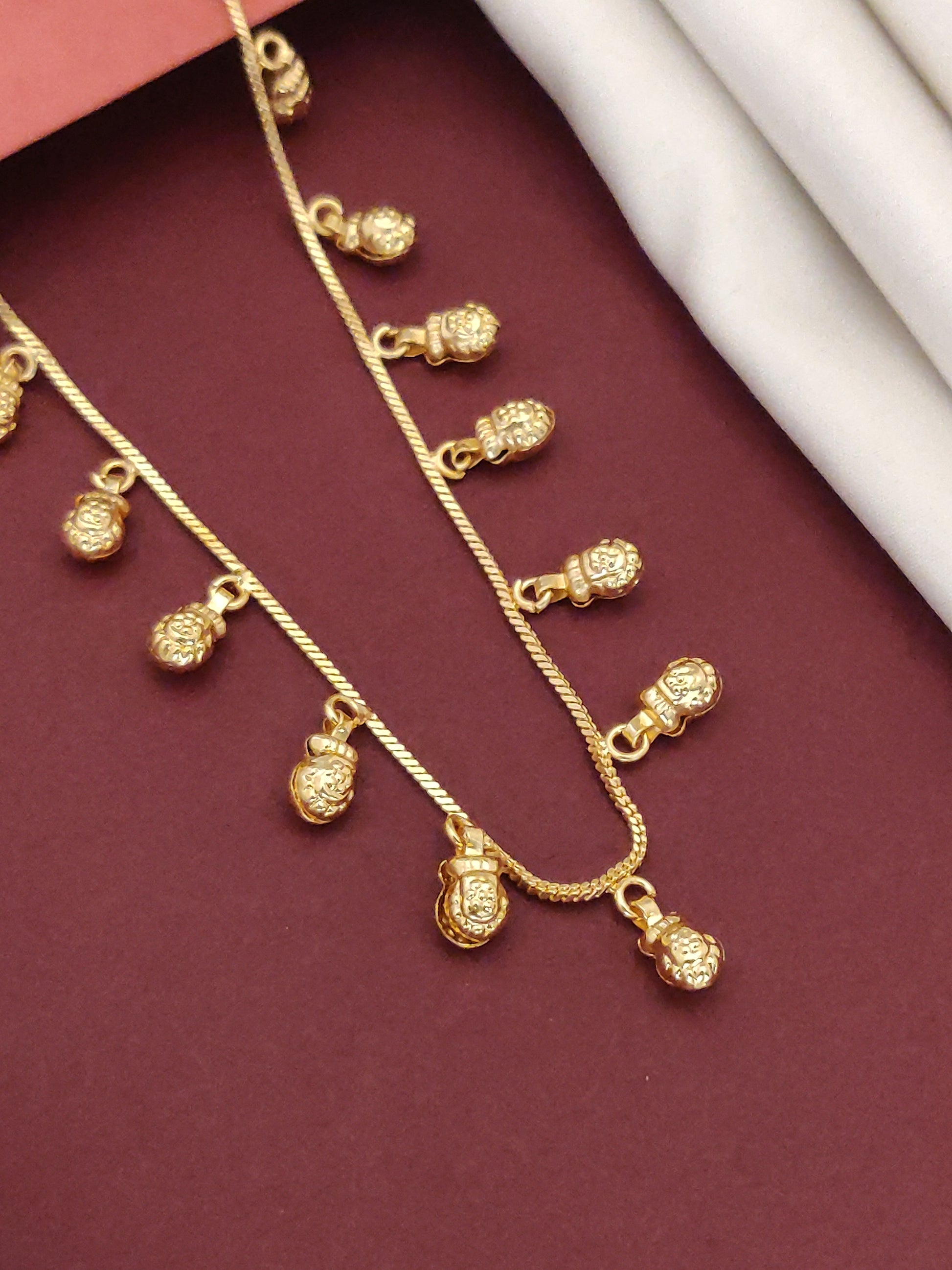 Gold plated daily wear chain with decorative pendants for a stylish and elegant look