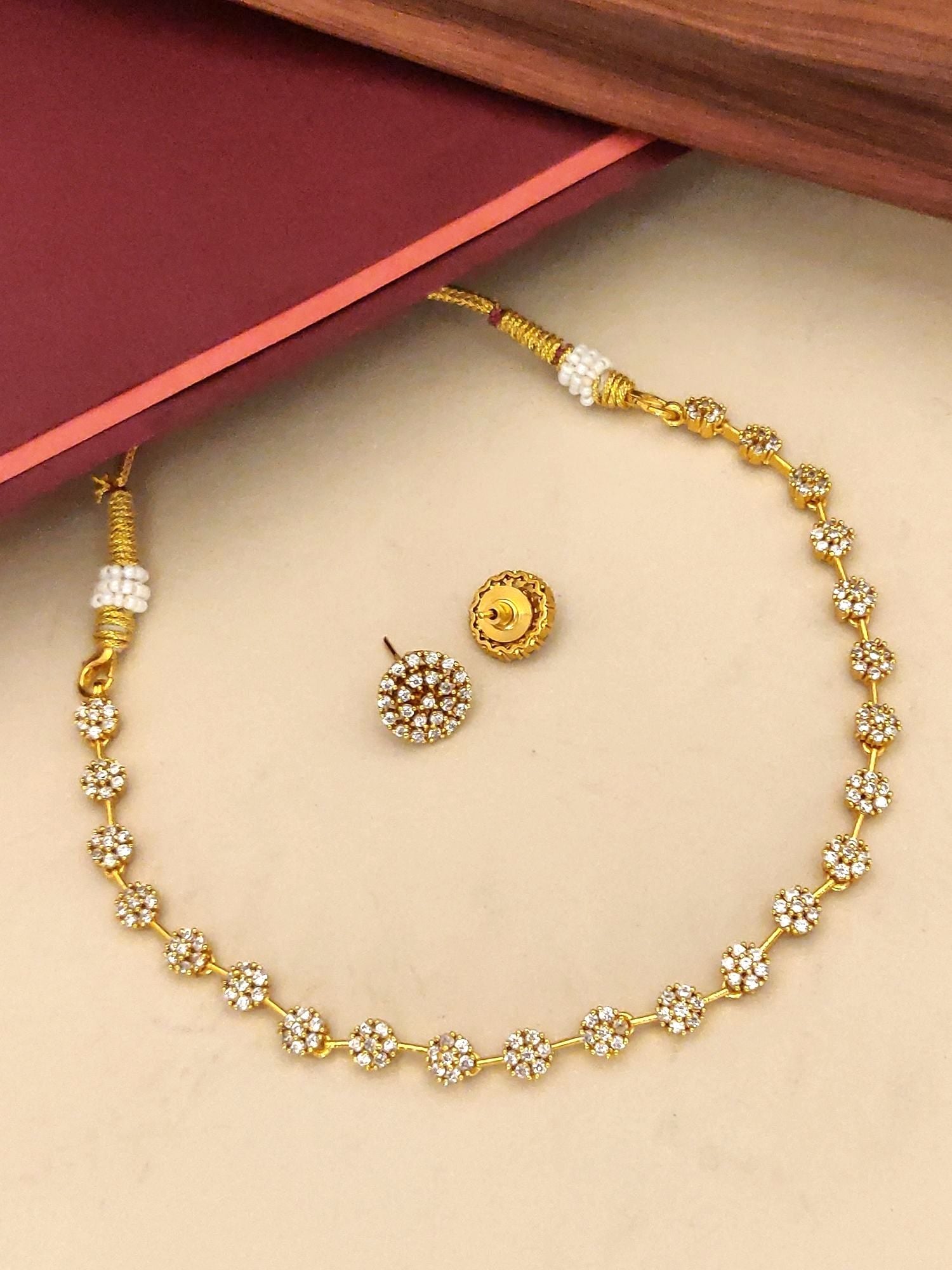 Gold plated diamond necklace set with sparkling stones and elegant design for special occasions