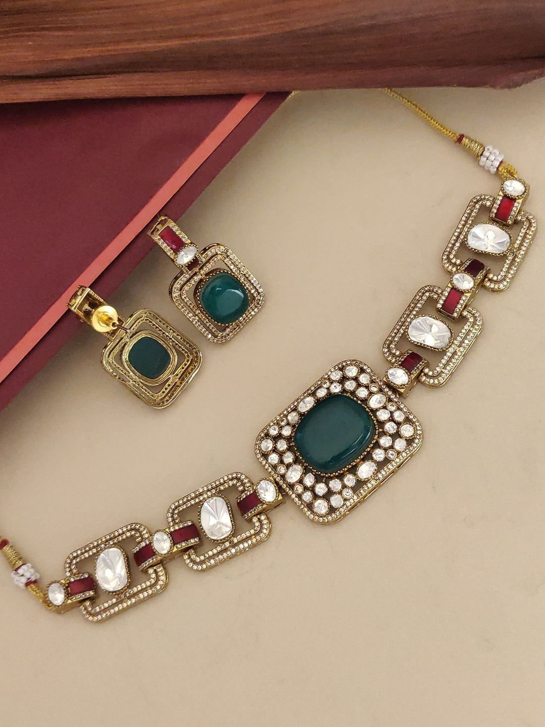 Gold Plated Green Stone Choker Necklace with intricate design and matching earrings for elegant styling