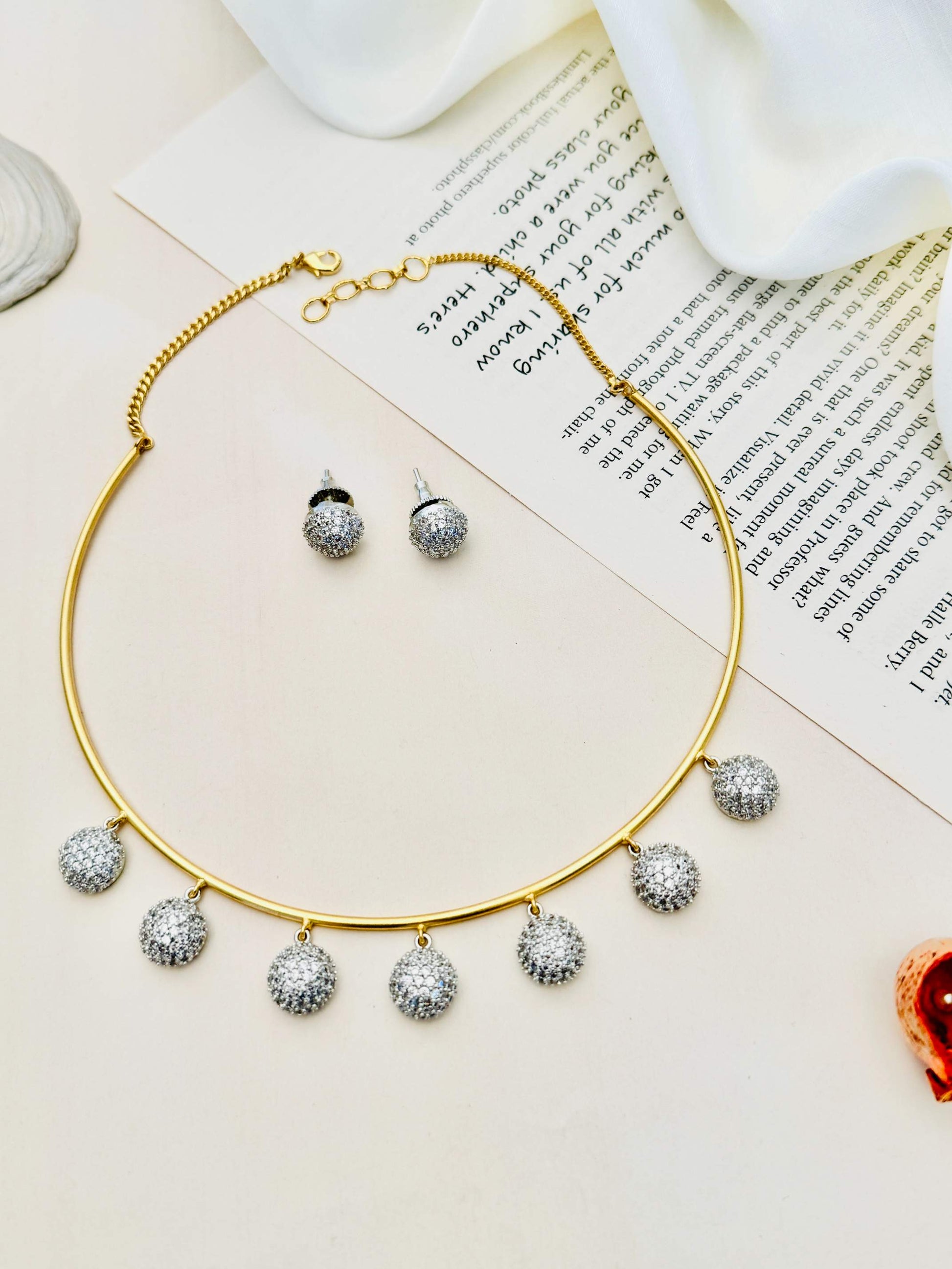 Abdesignsjewellery Gold Plated Hasli Necklace Set with matching silver stud earrings on white background