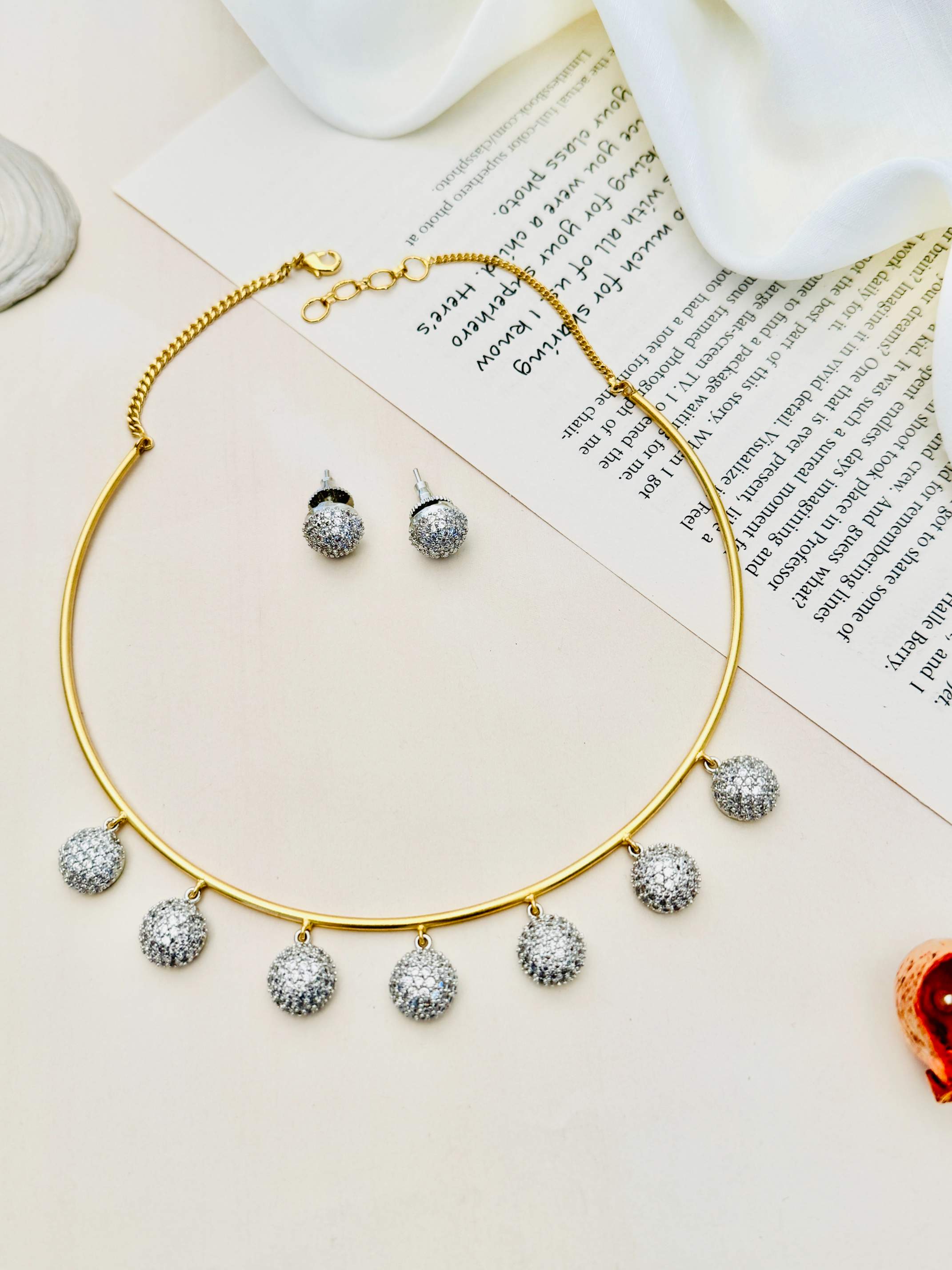 Abdesignsjewellery Gold Plated Hasli Necklace Set with matching silver stud earrings on white background