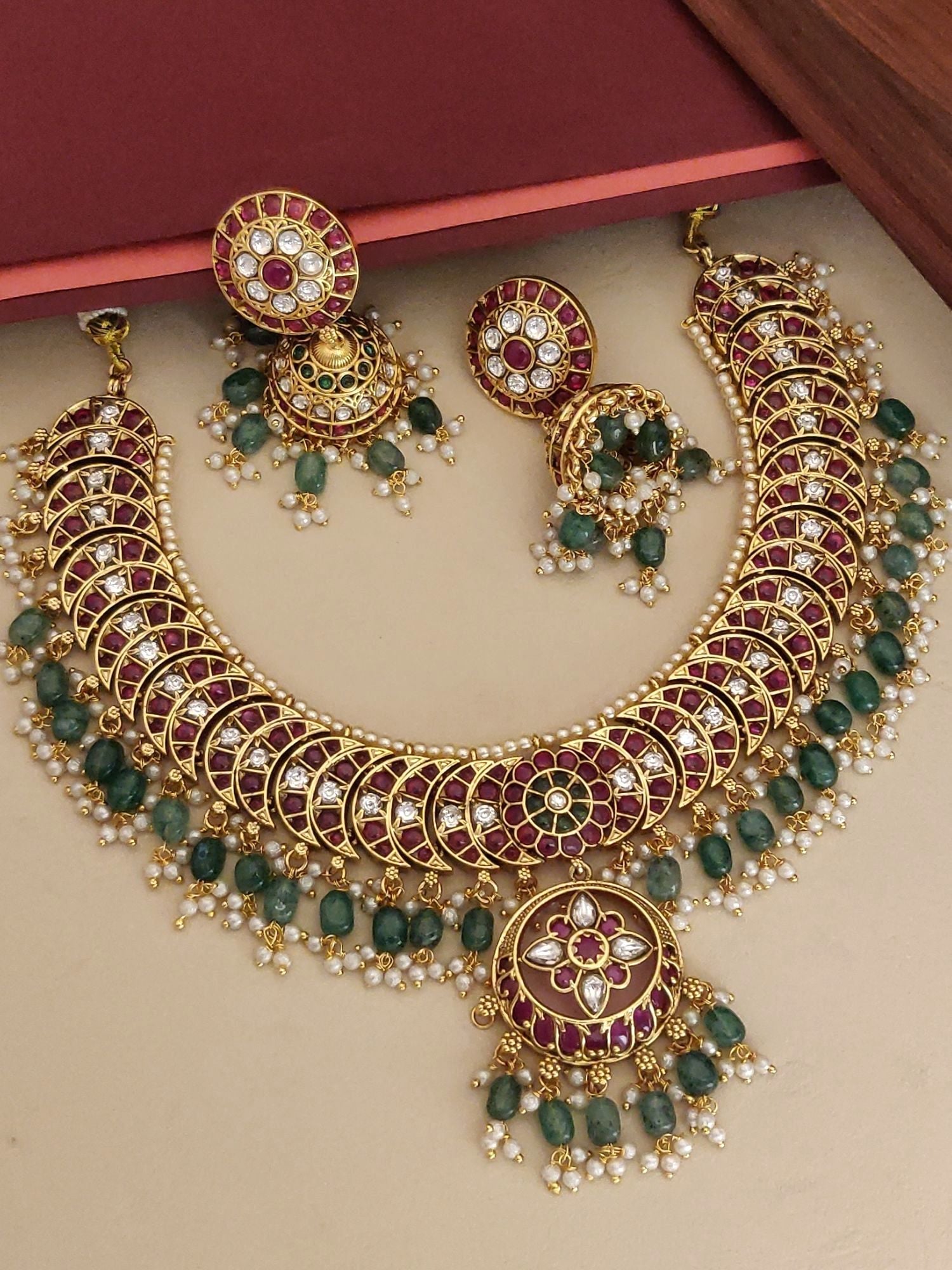 Elegant gold plated kempstone necklace set featuring intricate designs and matching earrings