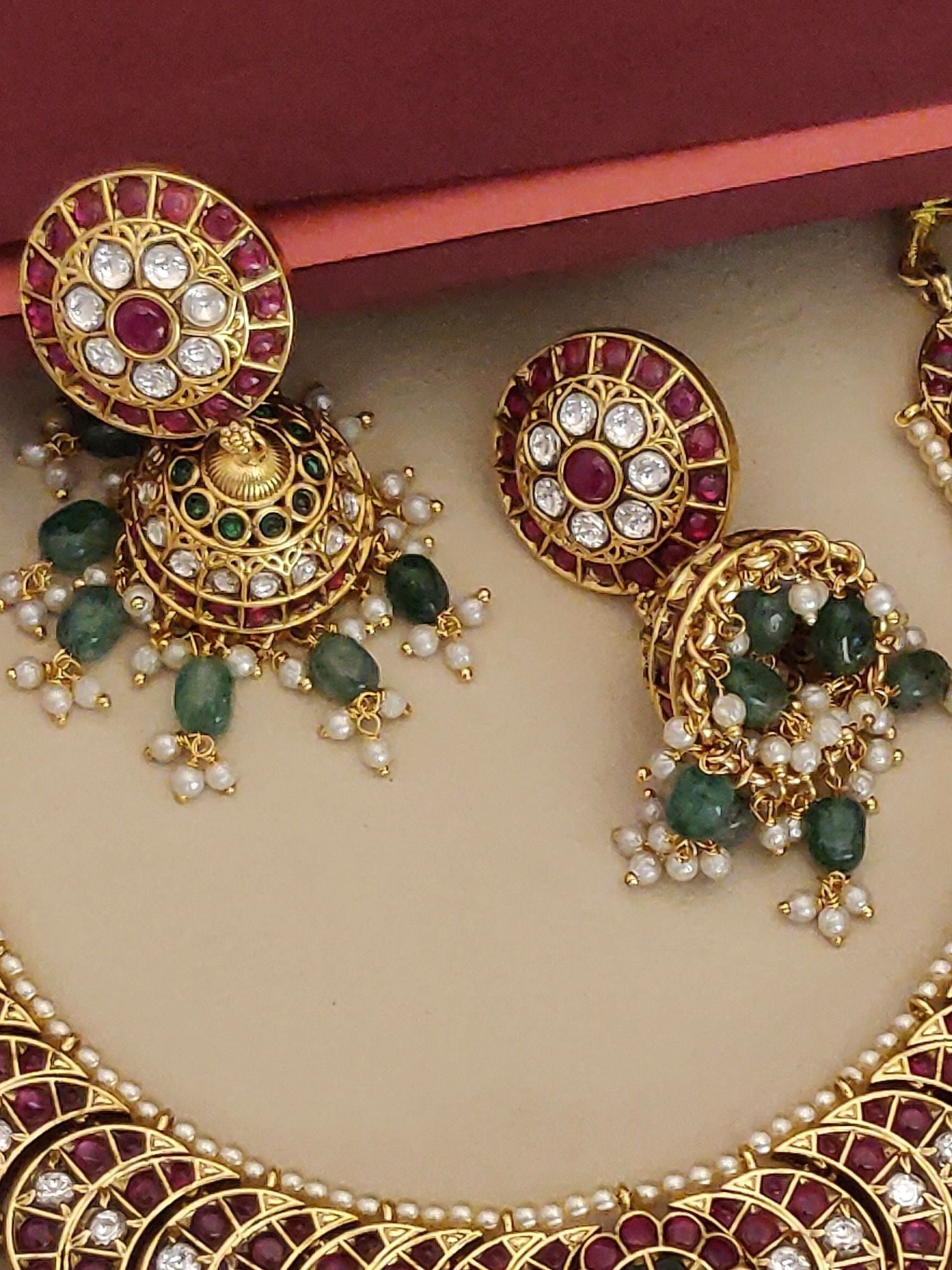 Elegant gold plated kempstone necklace set featuring intricate designs and vibrant gemstones
