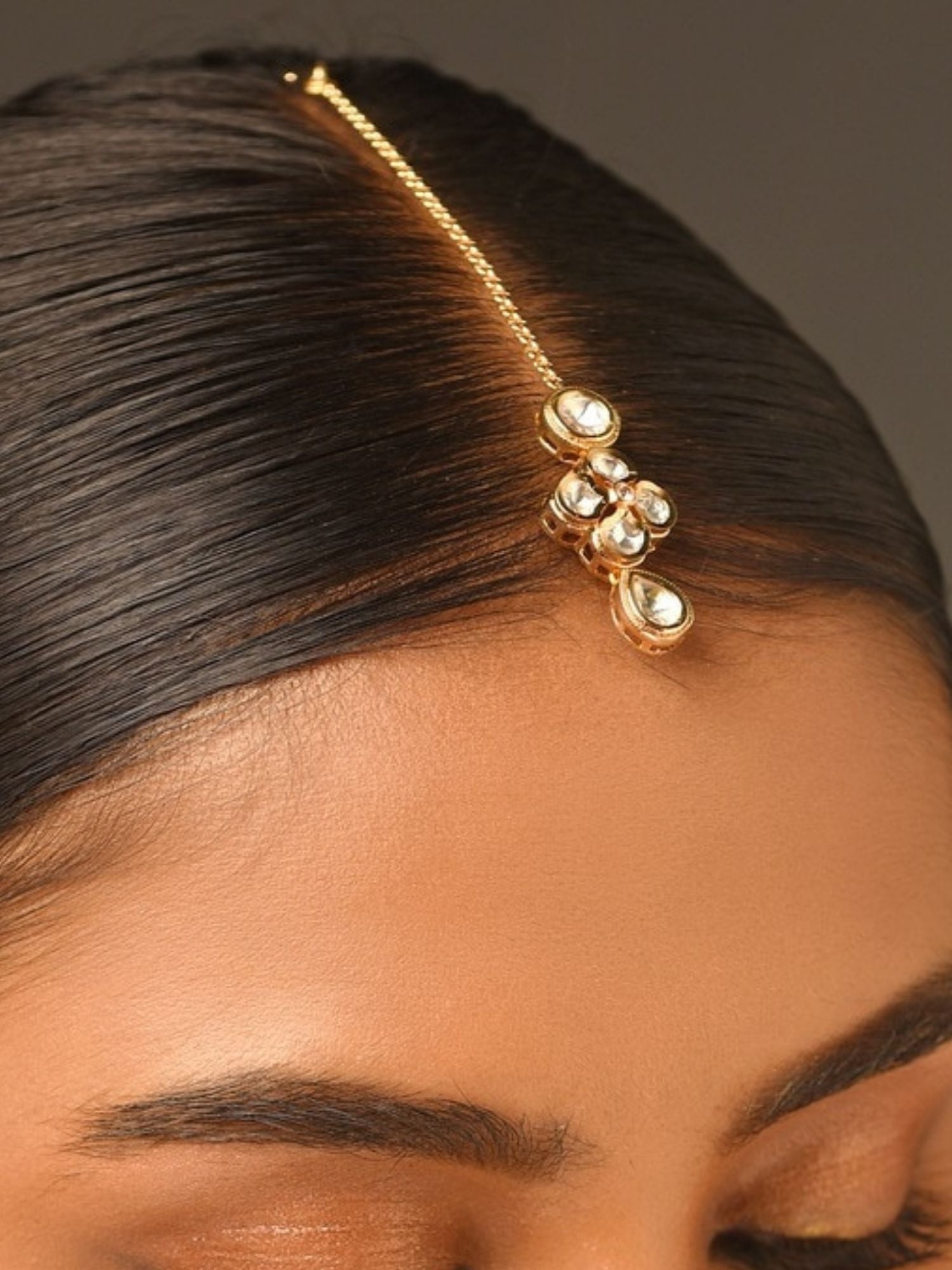 Gold Plated Kundan Maangtikka from Abdesignsjewellery worn on hair parting with intricate kundan stones