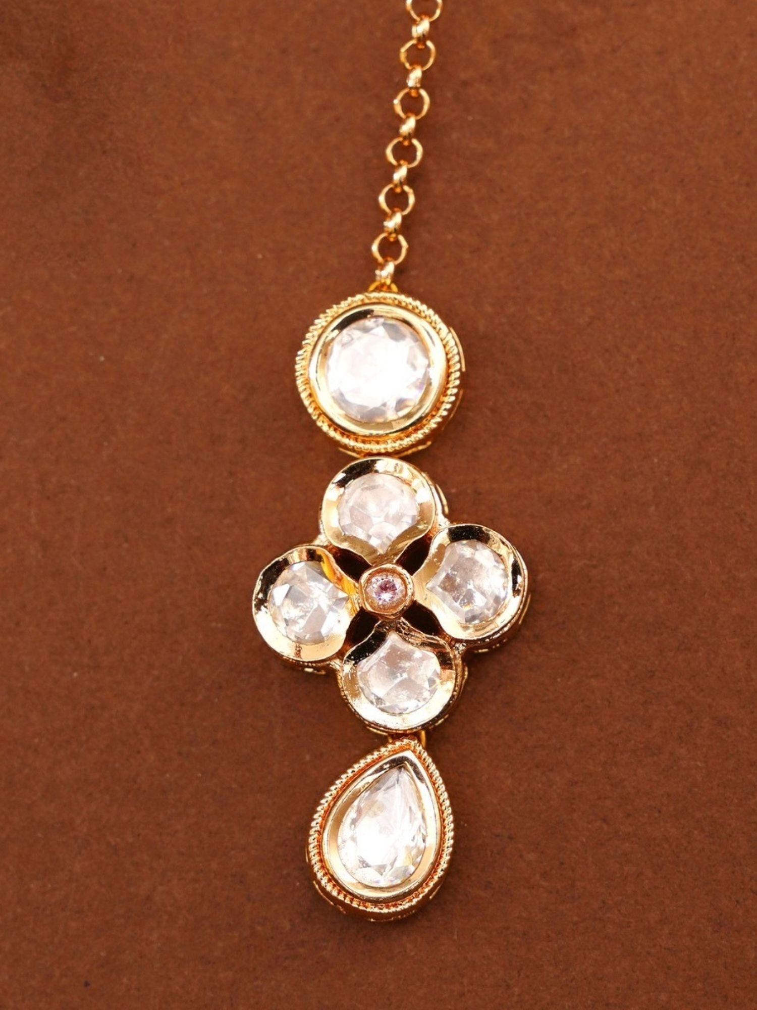 Gold Plated Kundan Maangtikka with clear kundan stones and intricate gold detailing by Abdesignsjewellery