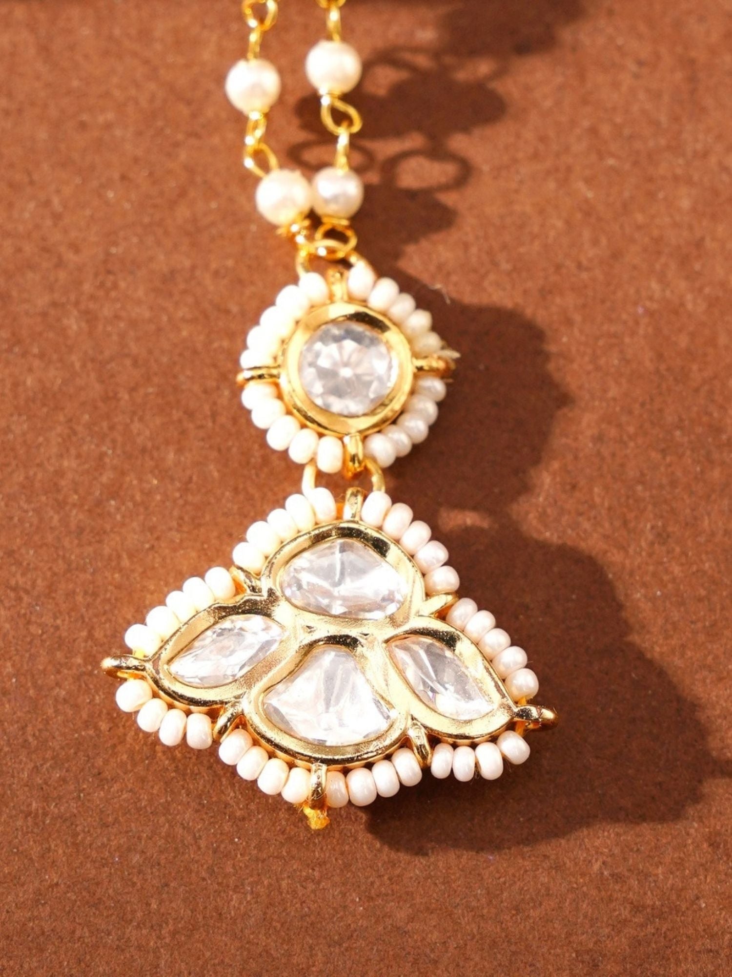 Gold Plated Kundan Maangtikka with white beads and clear gemstones on a gold chain by Abdesignsjewellery