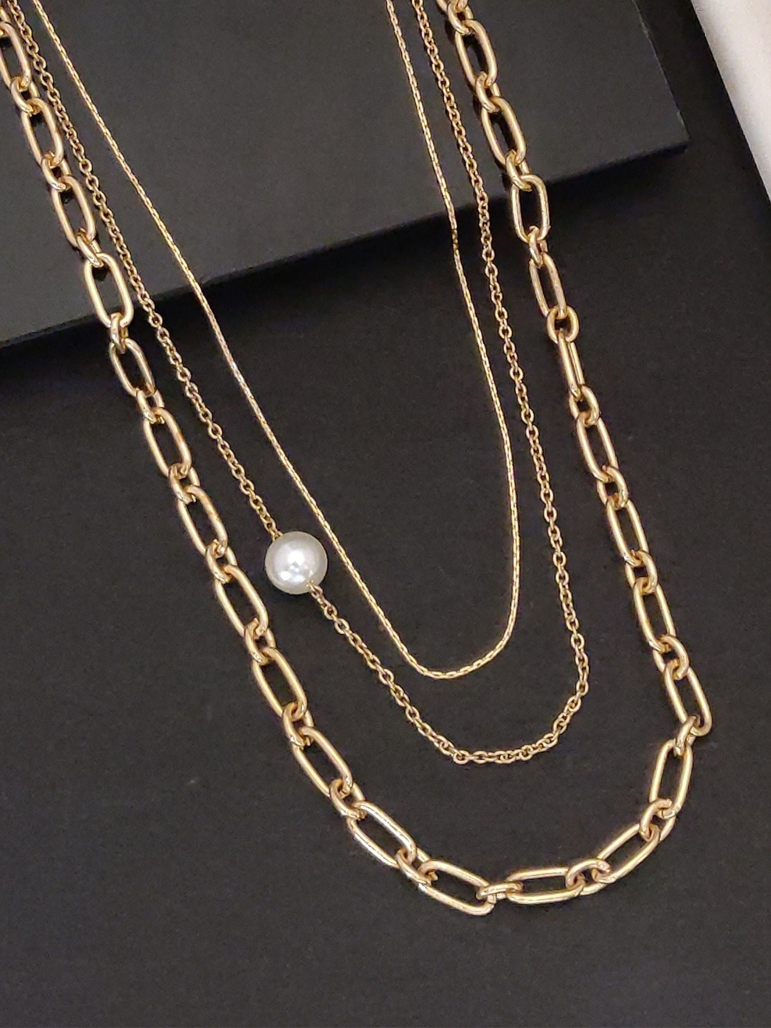Gold plated layered necklace with elegant chains and a pearl accent for stylish outfits