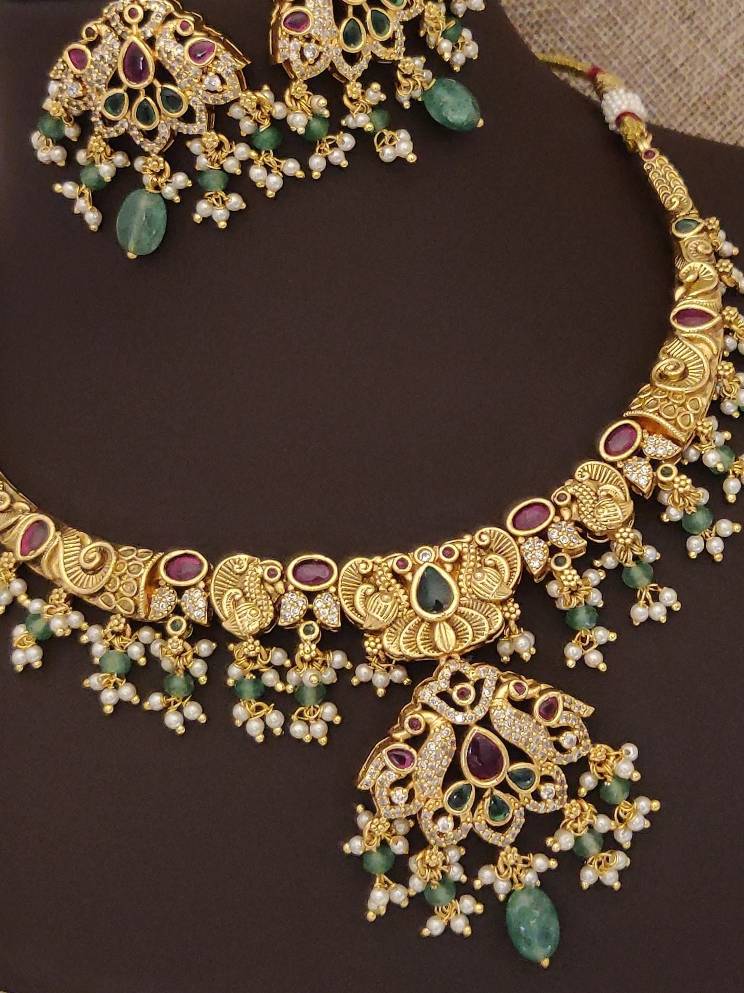 Abdesigns Jewellery gold plated multicolor necklace set with intricate design and gemstone accents