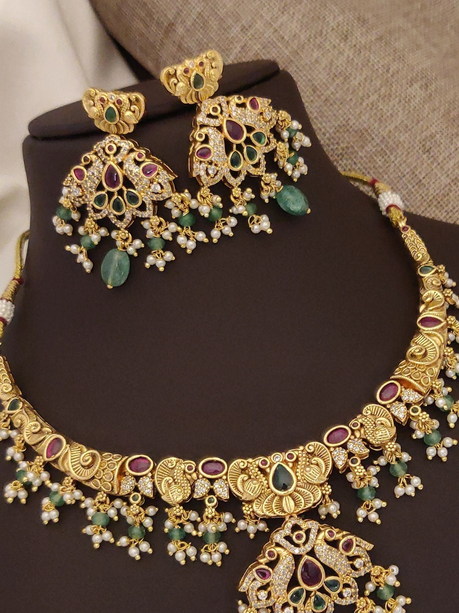 Abdesigns Jewellery gold plated multicolor necklace set with intricate design and matching earrings