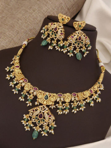 Gold plated multicolor necklace set featuring intricate floral designs and vibrant gemstones