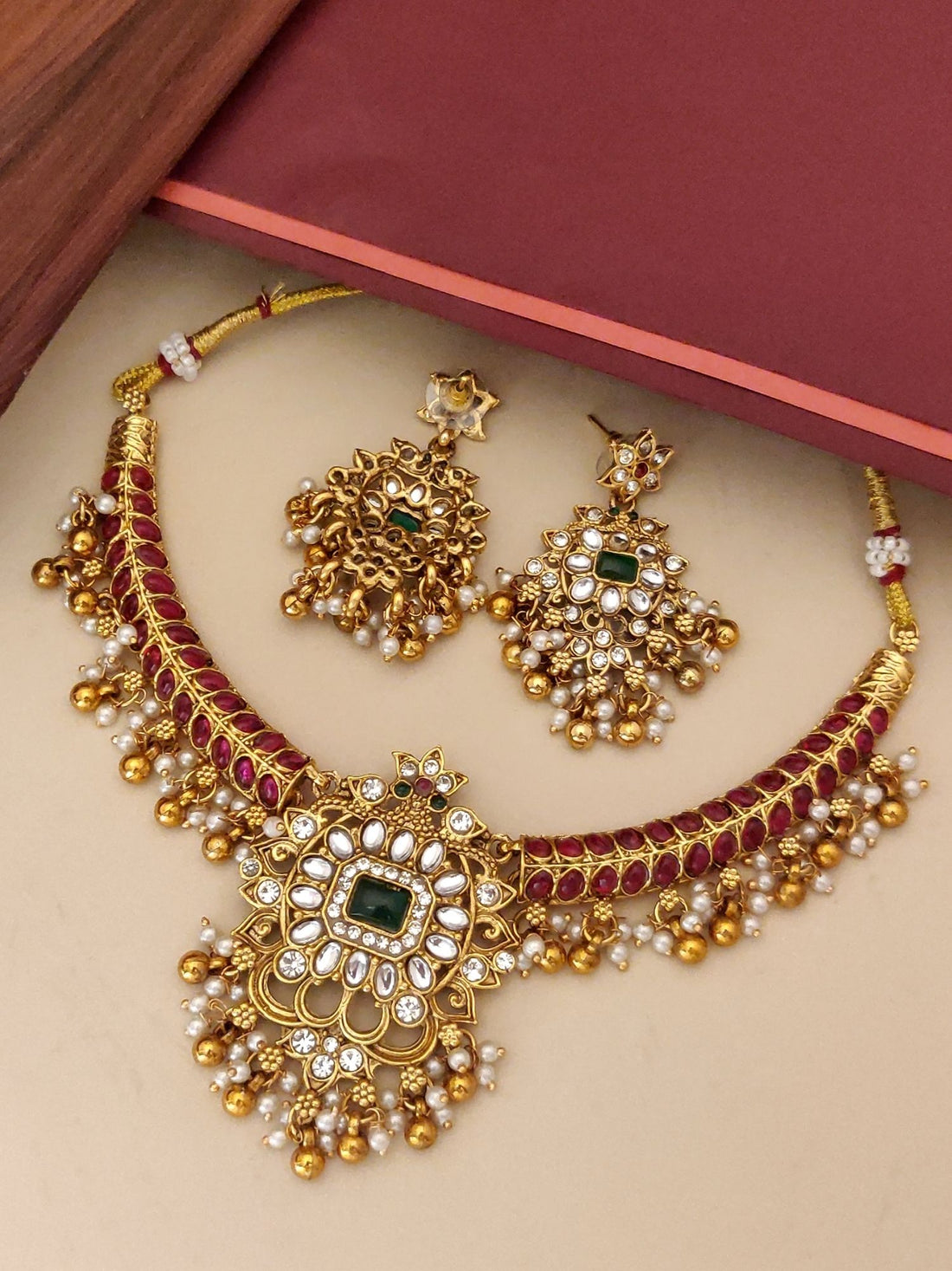 Abdesignsjewellery gold plated necklace set for women with green stone centerpiece and matching jhumka earrings