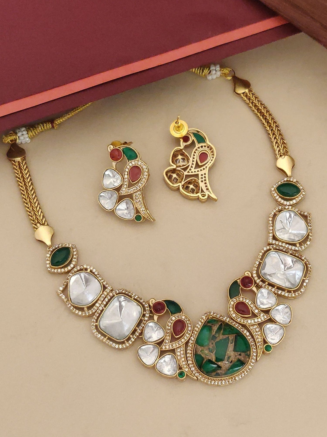 Gold Plated Peacock Polki Stone Necklace Set with intricate design and matching earrings