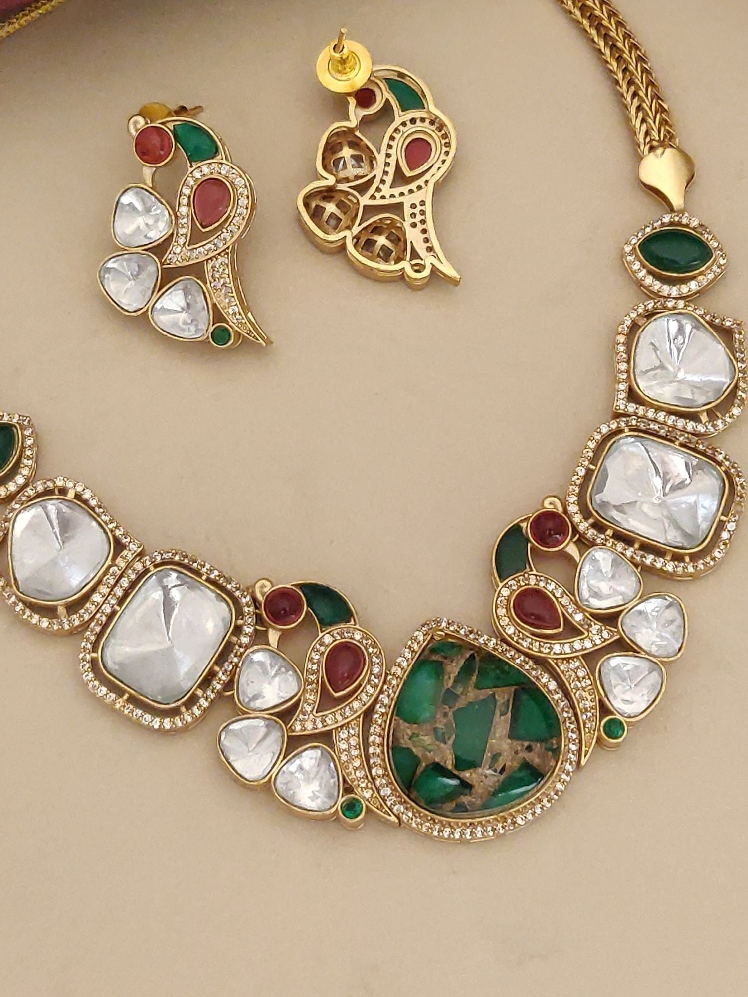 Gold Plated Polki Stone Necklace Set with Intricate Design and Matching Earrings