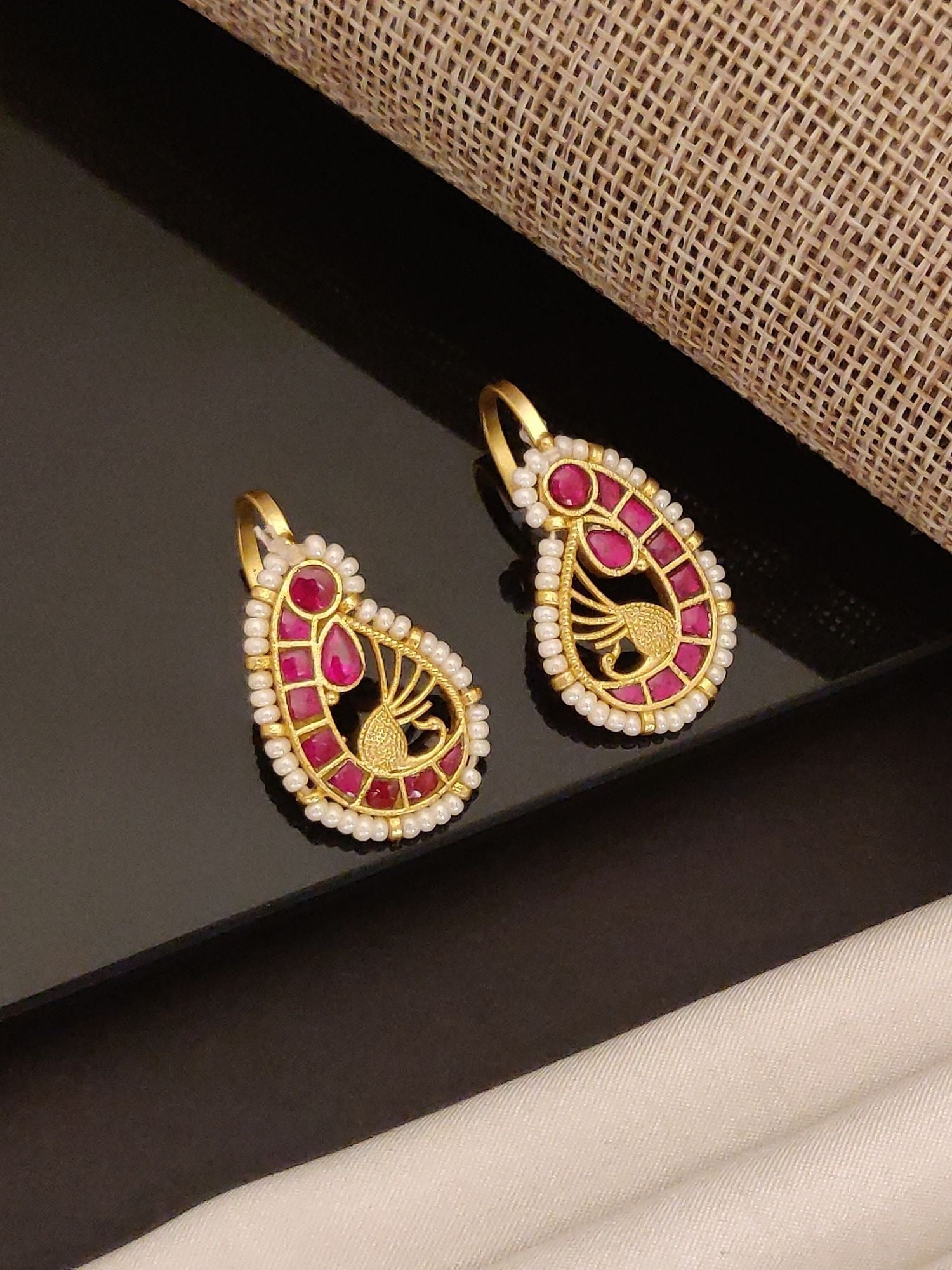 Abdesignsjewellery gold plated pearl ruby earrings teardrop design with ruby inlay and pearl border hook backs