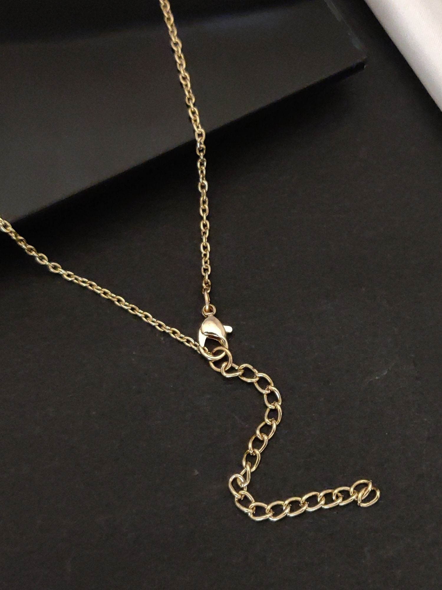Delicate gold plated pendant necklace with adjustable chain and secure clasp for elegant layering
