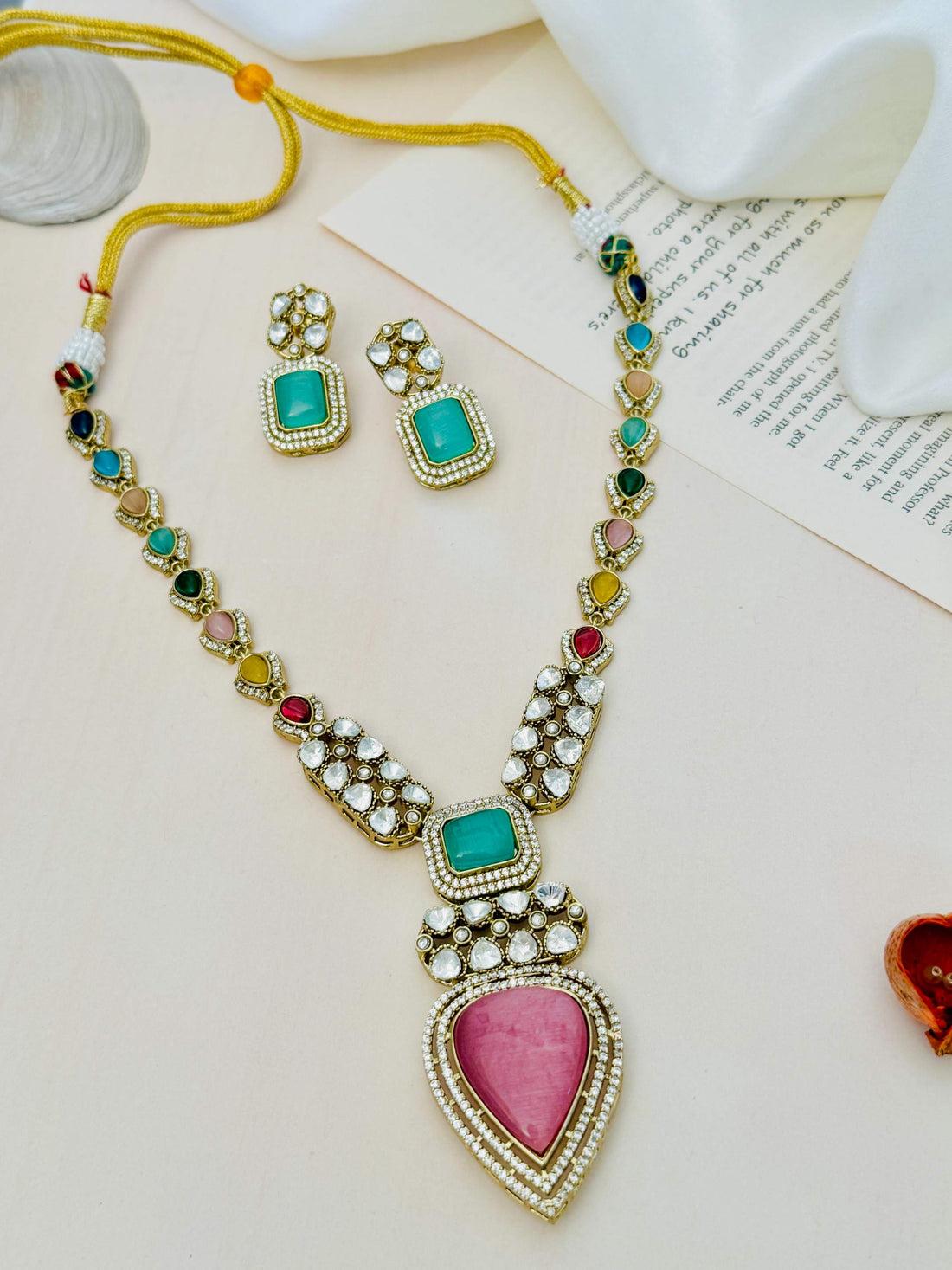 Gold Plated Polki Bridal Necklace Set with multicolor stones worn by woman in black off-shoulder top