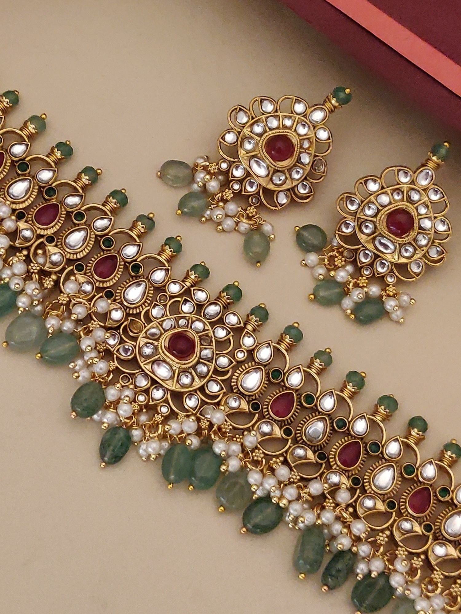 Gold Plated Polki Kundan Necklace Set with intricate design and matching earrings for elegant occasions