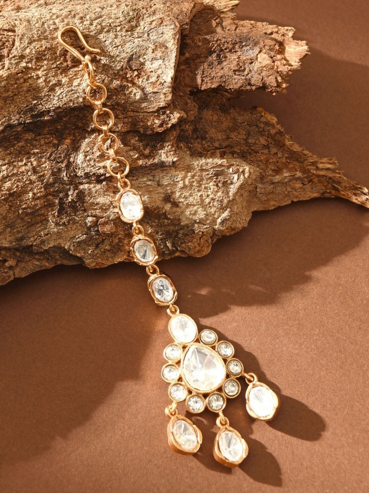 Gold Plated Polki Maangtikka with clear stones and intricate design by Abdesignsjewellery