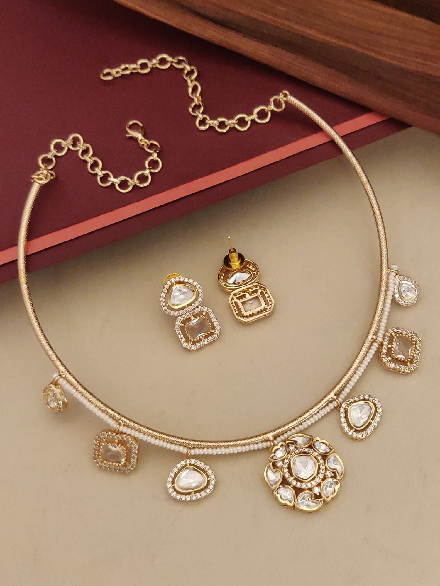 Gold Plated Polki Studed Hasli Necklace Set with elegant design and matching earrings