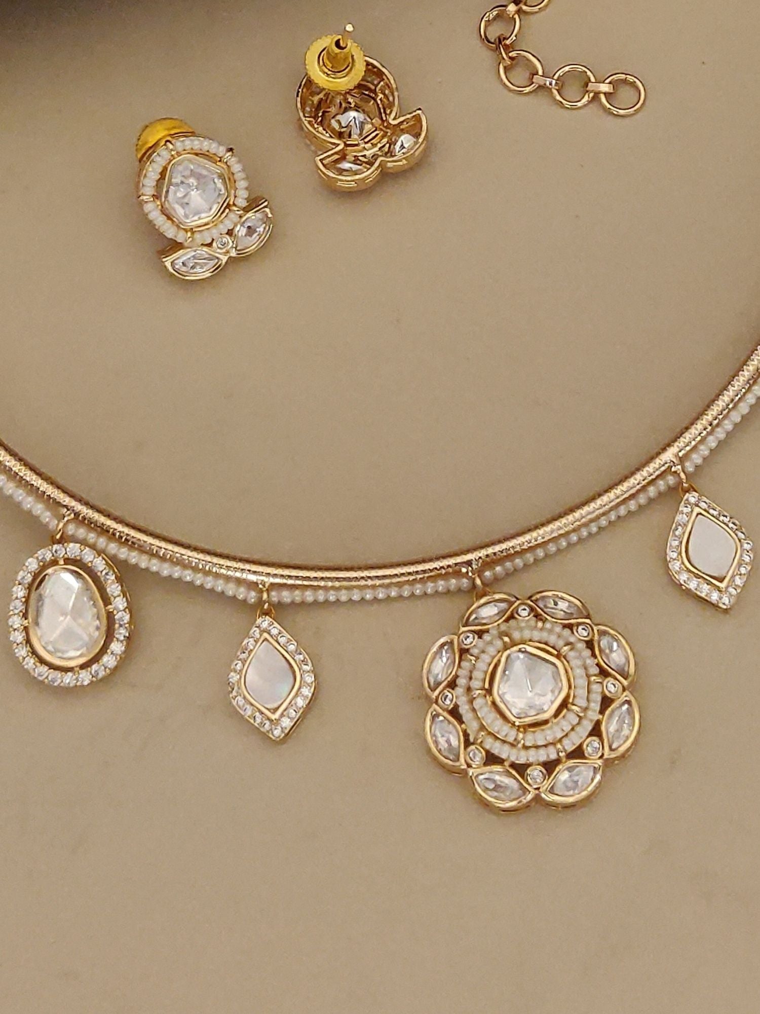 Gold Plated Polki Studed Hasli Necklace Set featuring delicate motifs and elegant earrings
