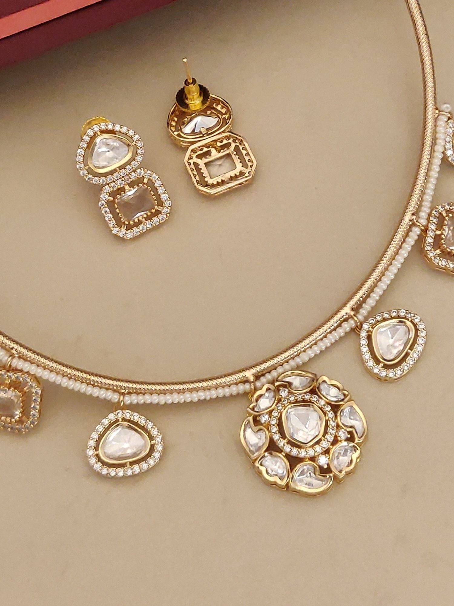 Gold Plated Polki Studed Hasli Necklace Set with intricate designs and matching earrings