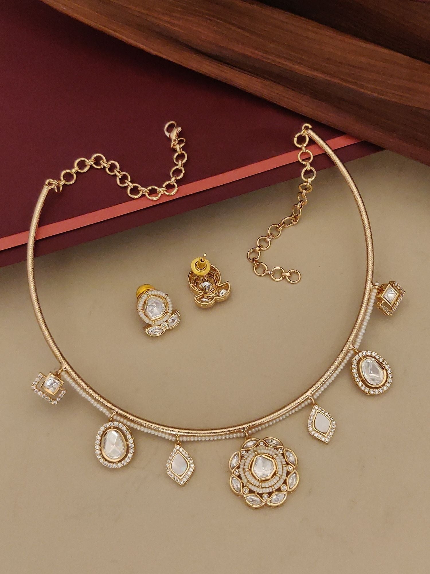 Gold Plated Polki Studed Hasli Necklace Set with intricate designs and matching earrings