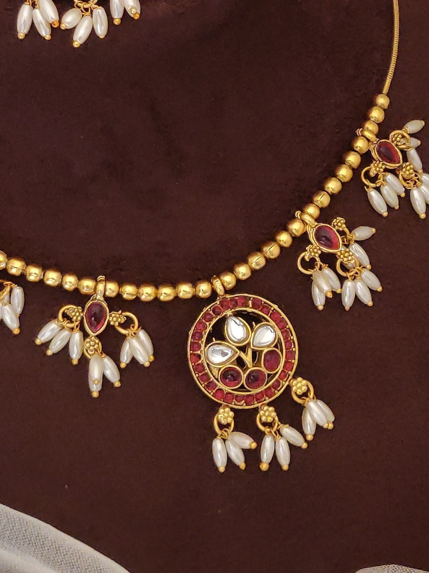 Abdesignsjewellery gold plated ruby kempstone necklace set with round pendant white pearl drops and bead chain