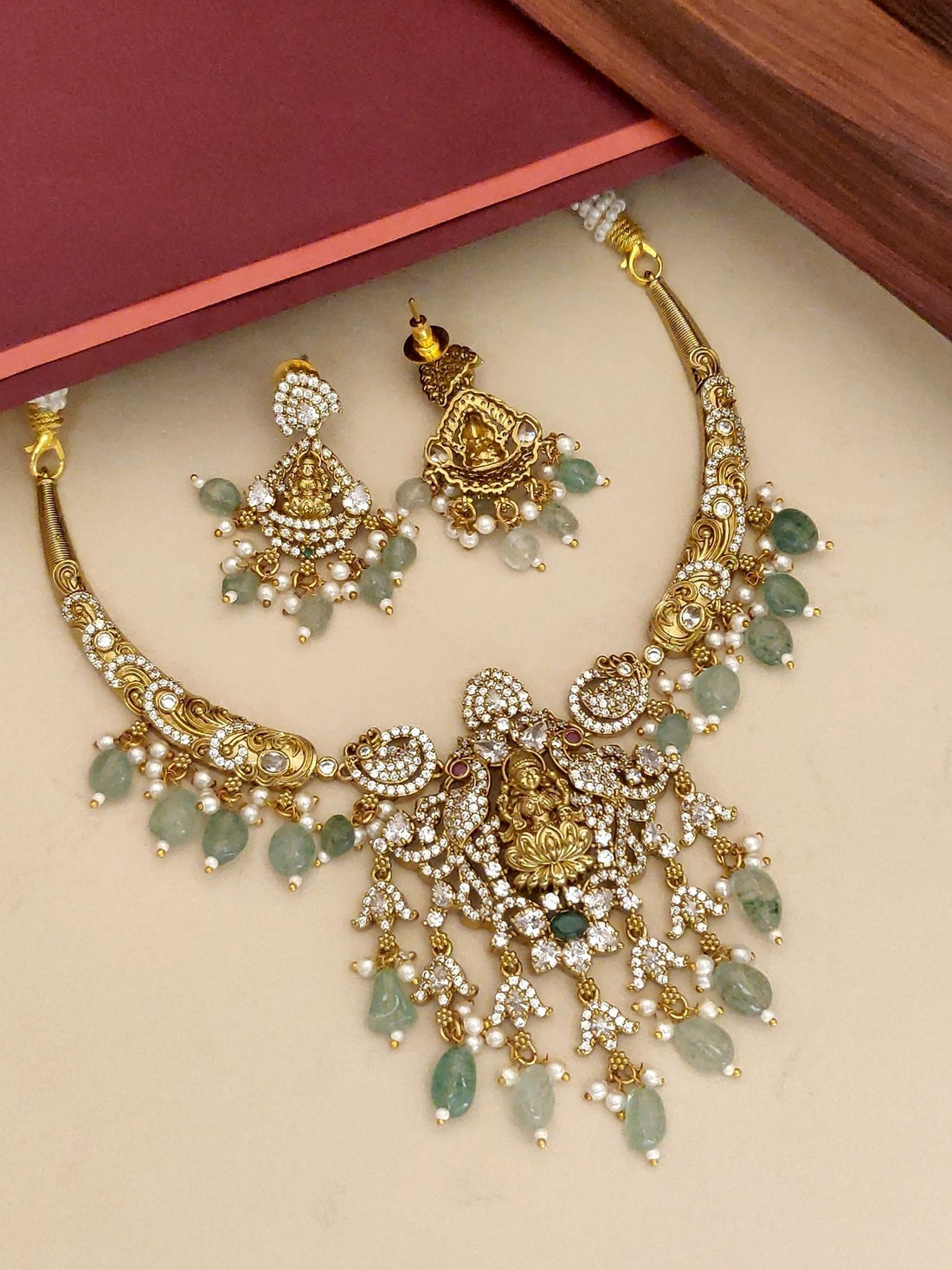 Gold Plated Temple Necklace Set with Intricate Design and Matching Earrings for Traditional Occasions